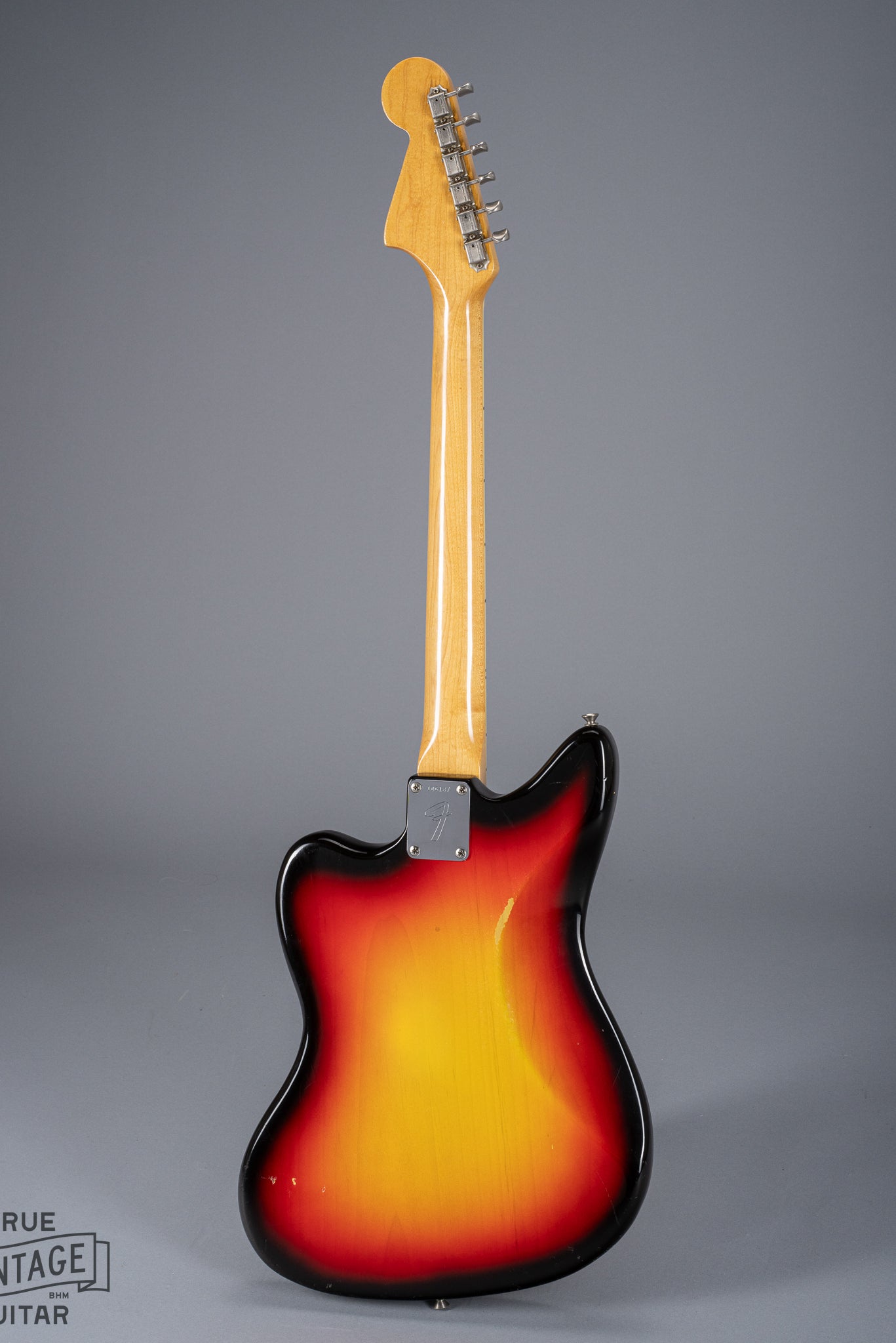 Full Back of 1965 Fender Jaguar Sunburst Pickups Neck Tuning Machines Neck Plate Serial Number F Logo Neck Plate Fretboard Binding Tortoise Shell Pick Guard Offset