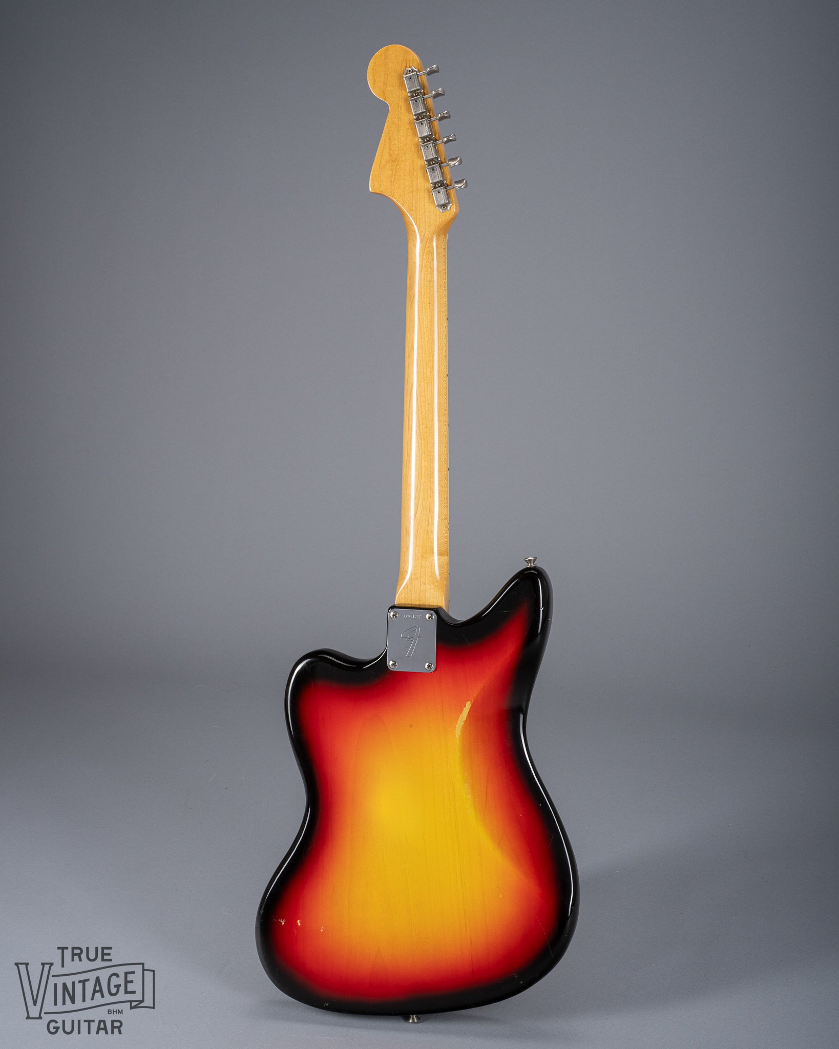 Full Back of 1965 Fender Jaguar Sunburst Pickups Neck Tuning Machines Neck Plate Serial Number F Logo Neck Plate Fretboard Binding Tortoise Shell Pick Guard Offset