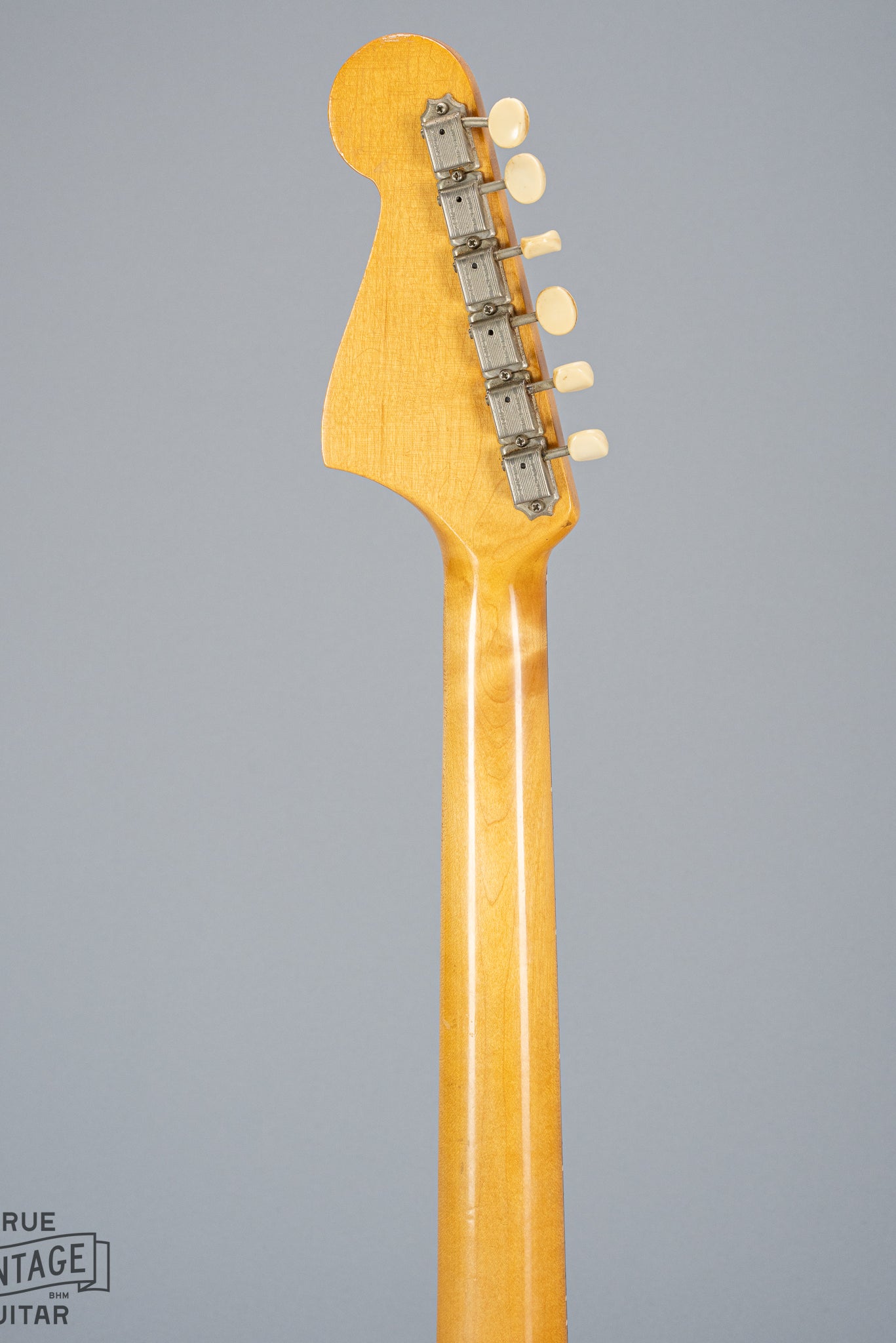 Back of 1965 Fender Mustang Red guitar neck and headstock tuning machines