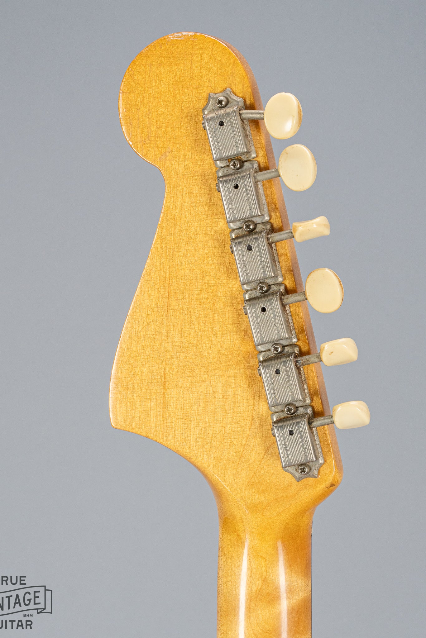 back of 1965 Fender Mustang Red guitar headstock tuning machines tuning buttons