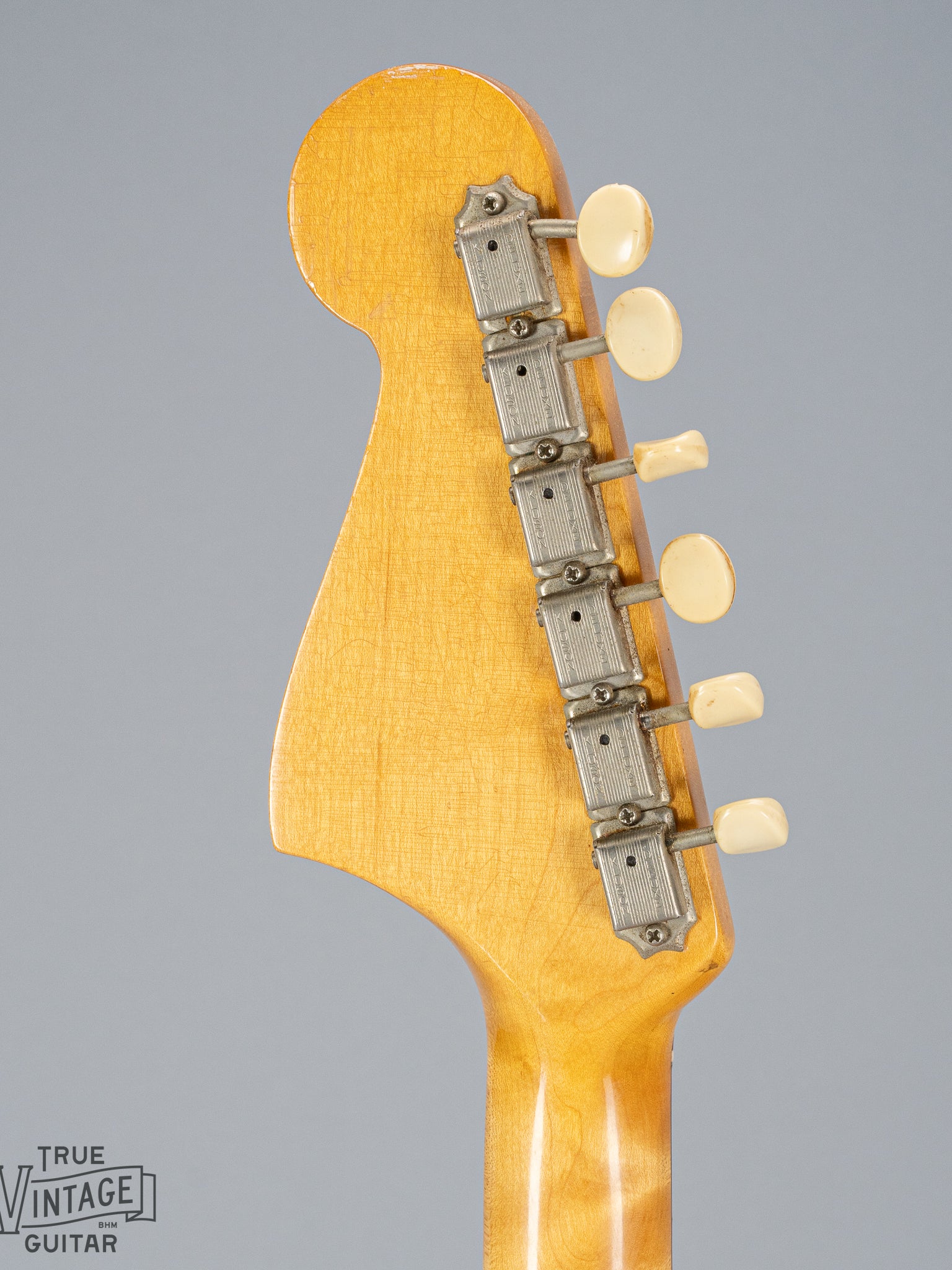 back of 1965 Fender Mustang Red guitar headstock tuning machines tuning buttons