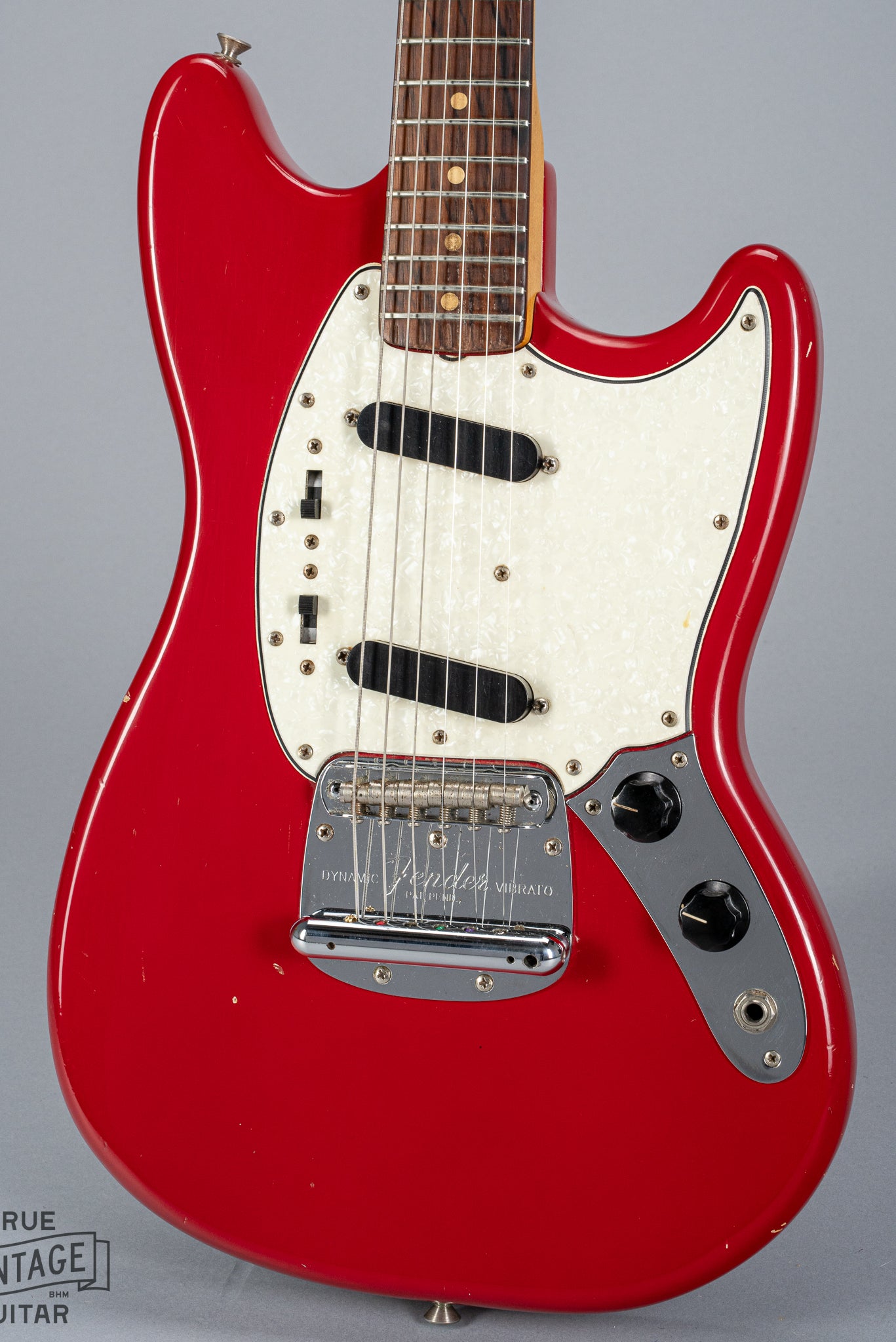 front of 1965 Fender Mustang Red guitar body sparkle pick guard single coils original hardware bridge