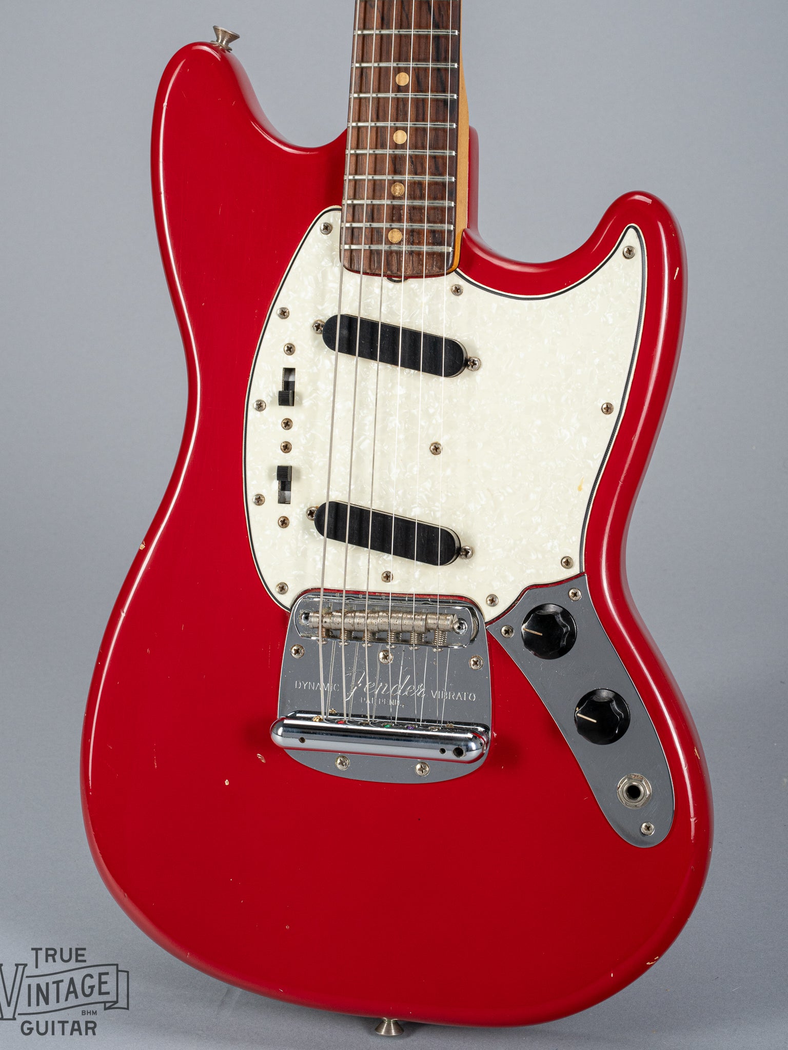 front of 1965 Fender Mustang Red guitar body sparkle pick guard single coils original hardware bridge