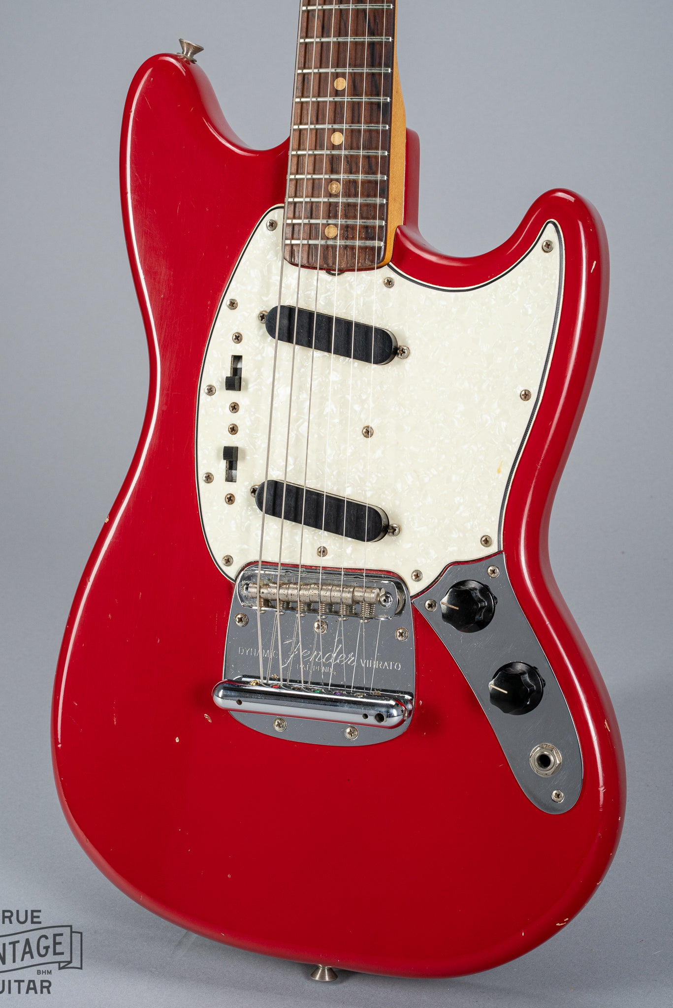 front of 1965 Fender Mustang Red guitar body sparkle pick guard single coils original hardware
