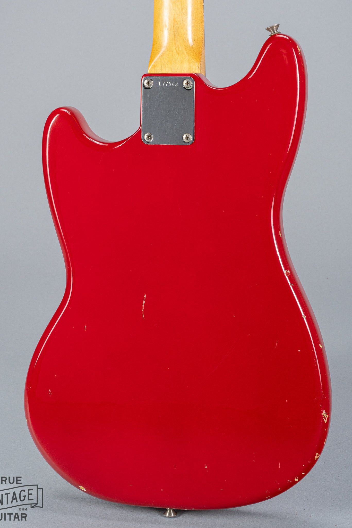 Back of 1965 Fender Mustang Red guitar neck plate serial number neck heel