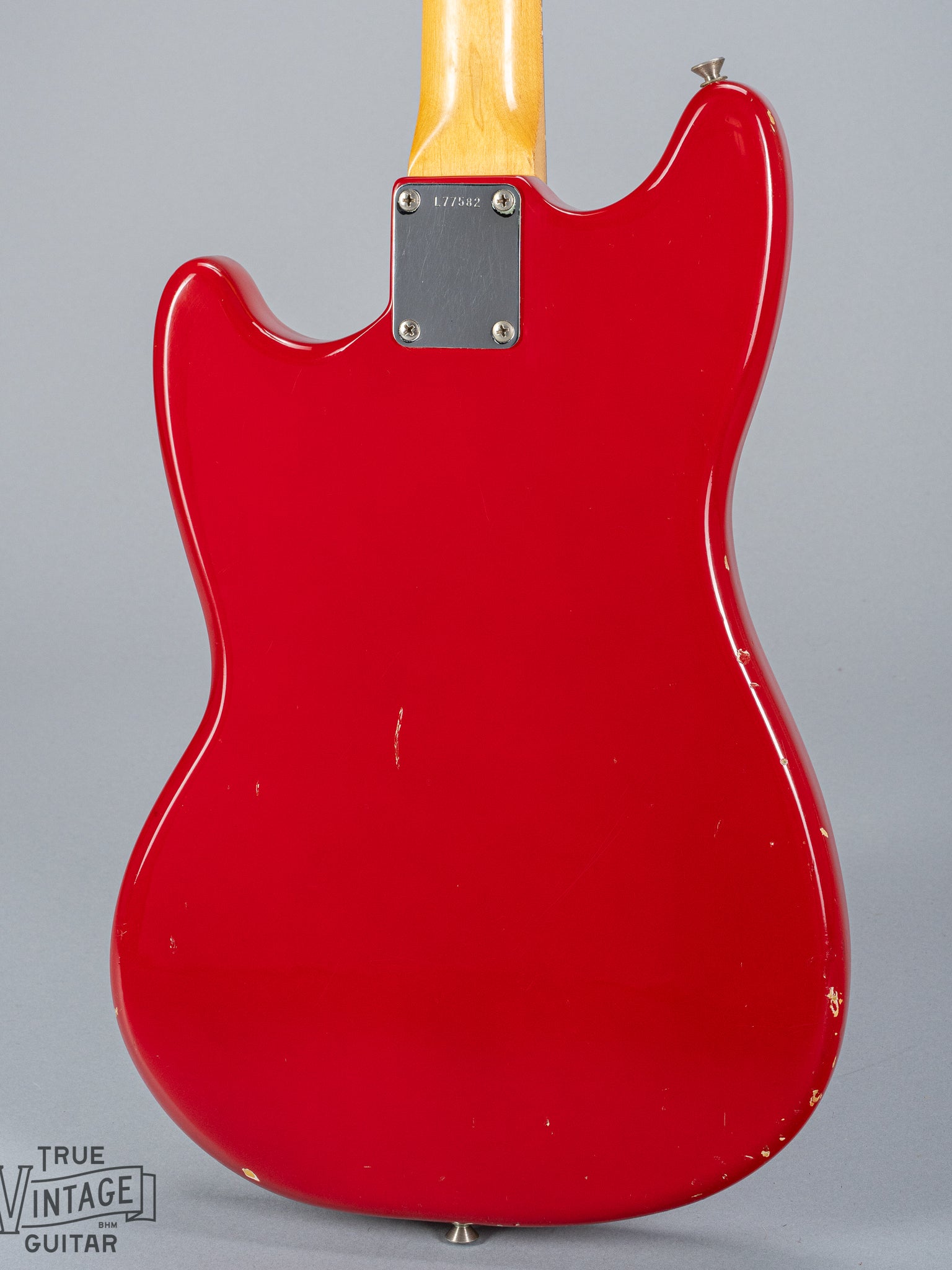 Back of 1965 Fender Mustang Red guitar neck plate serial number neck heel