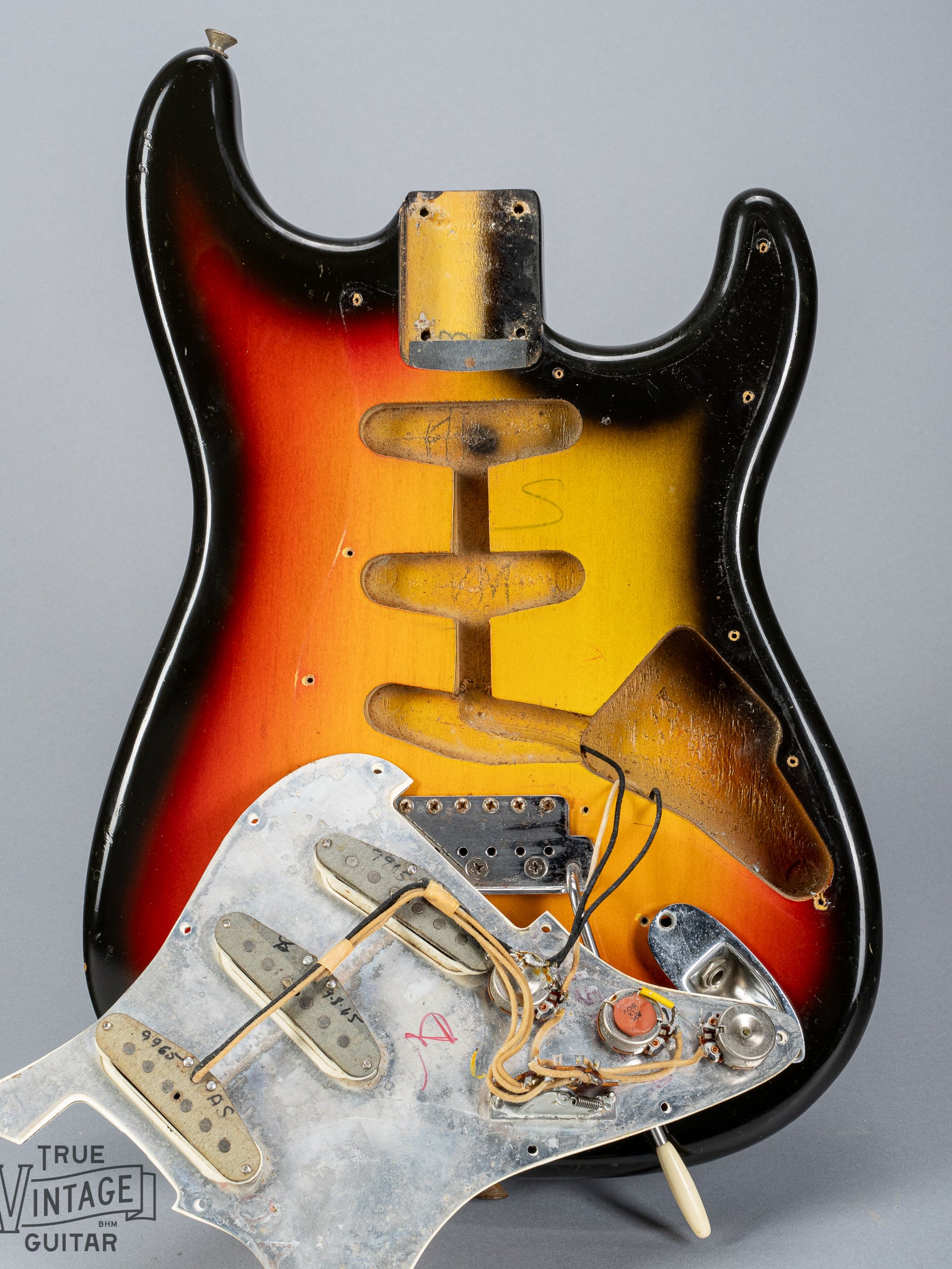 1965 Fender Stratocaster Sunburst under the pickguard pickups wiring electronics pots pickup route and cavity