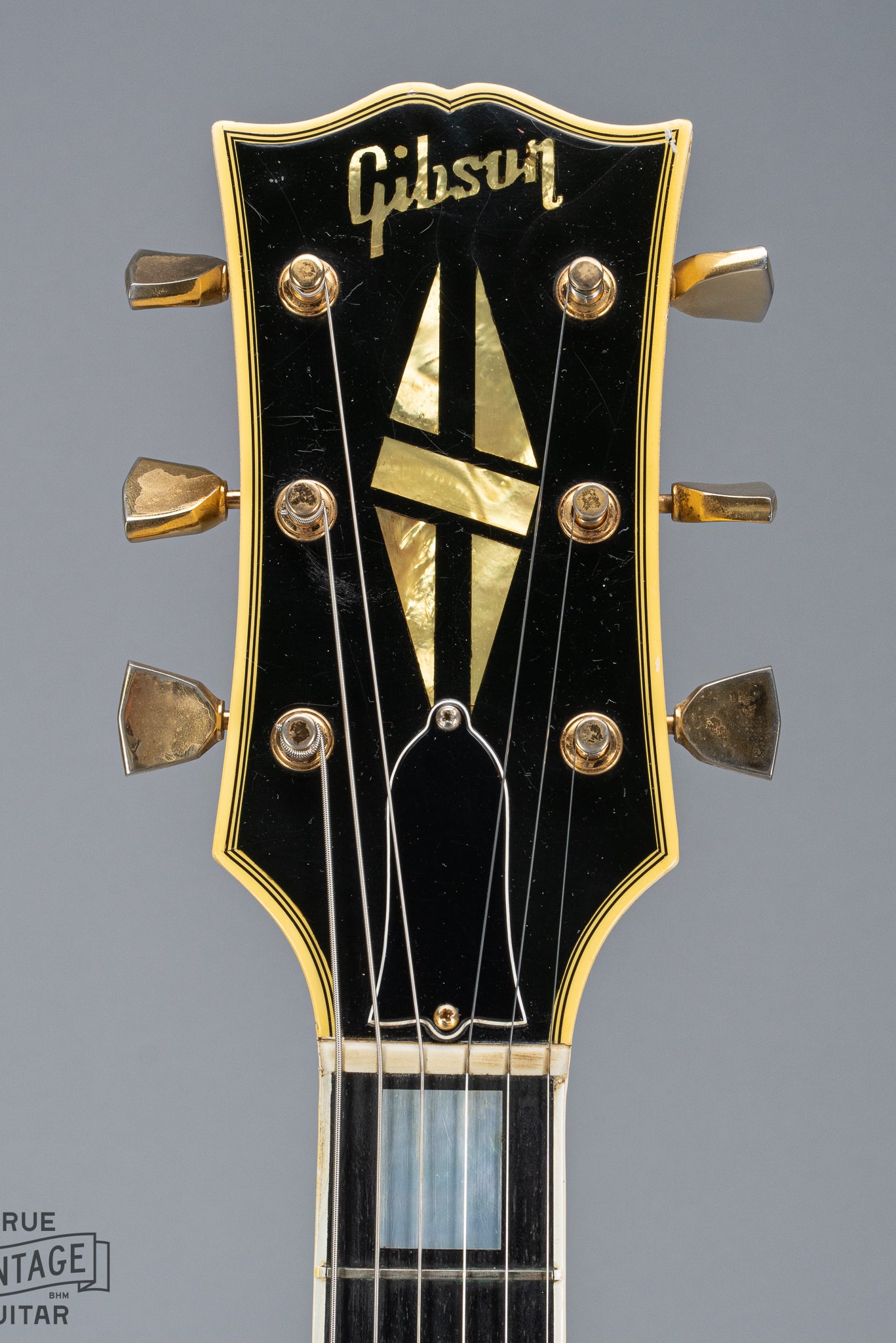 Front of 1965 Gibson SG Custom white guitar three pickup with Bigsby B5 vibrato tailpiece headstock