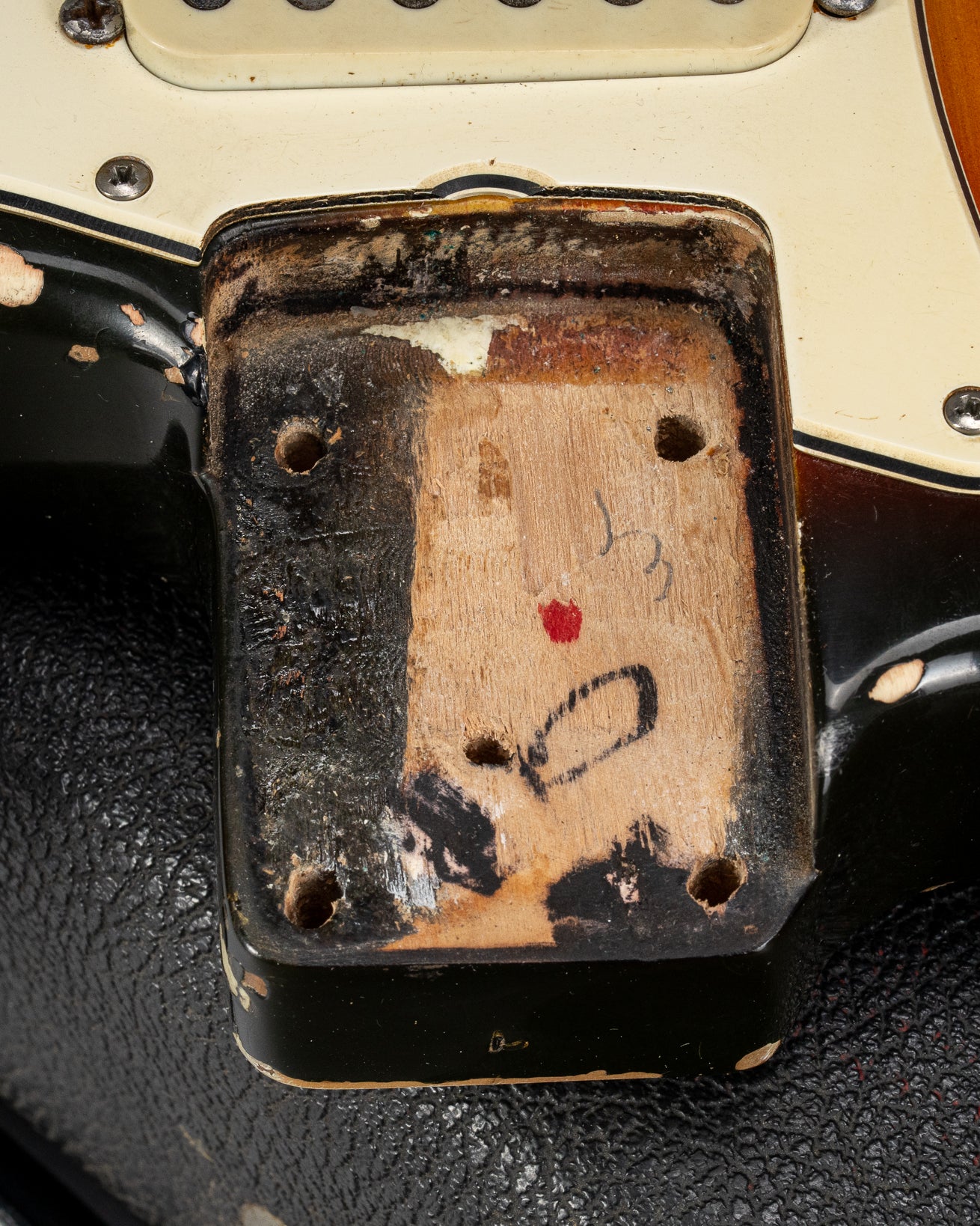 1970 Fender Stratocaster sunburst over white guitar neck pocket