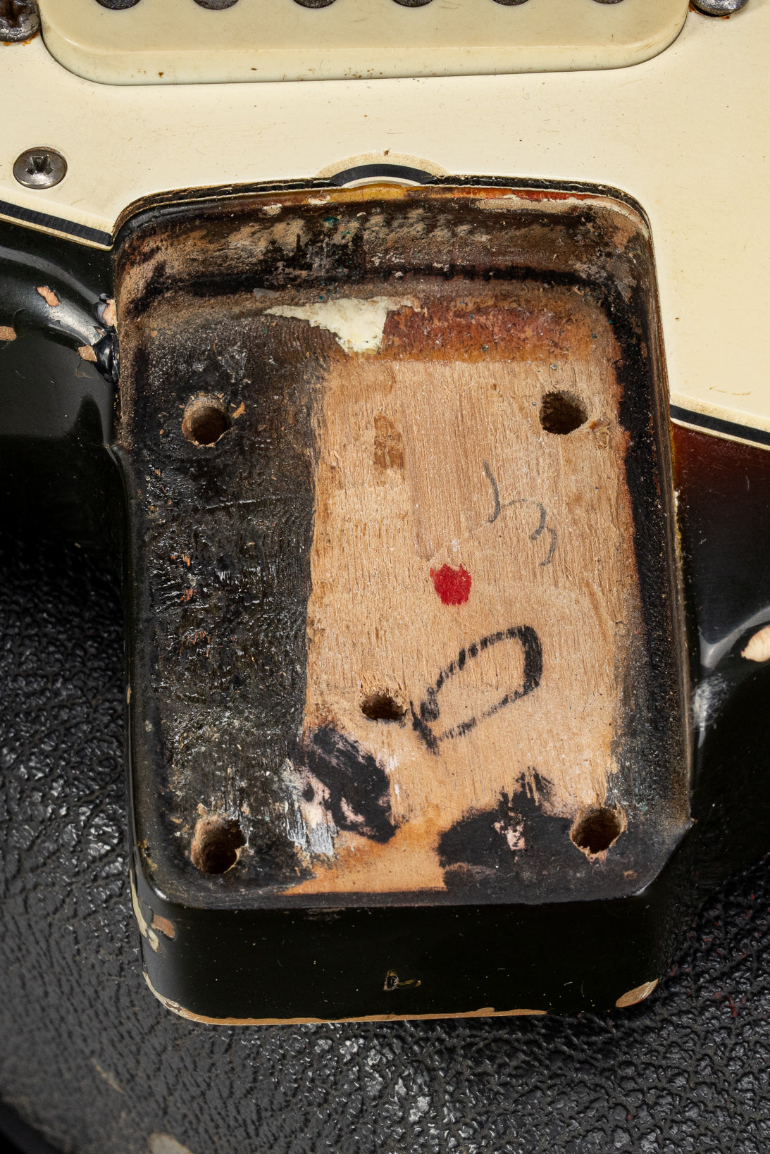 1970 Fender Stratocaster sunburst over white guitar neck pocket