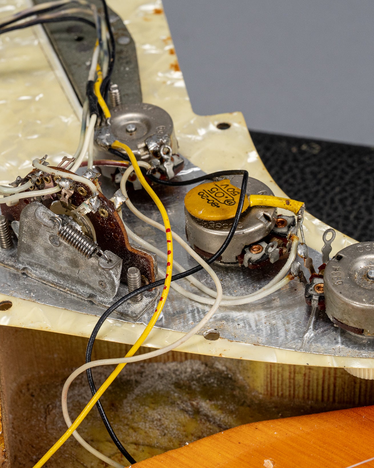 1970 Fender Stratocaster sunburst over white guitar interior pots, codes, wiring switch