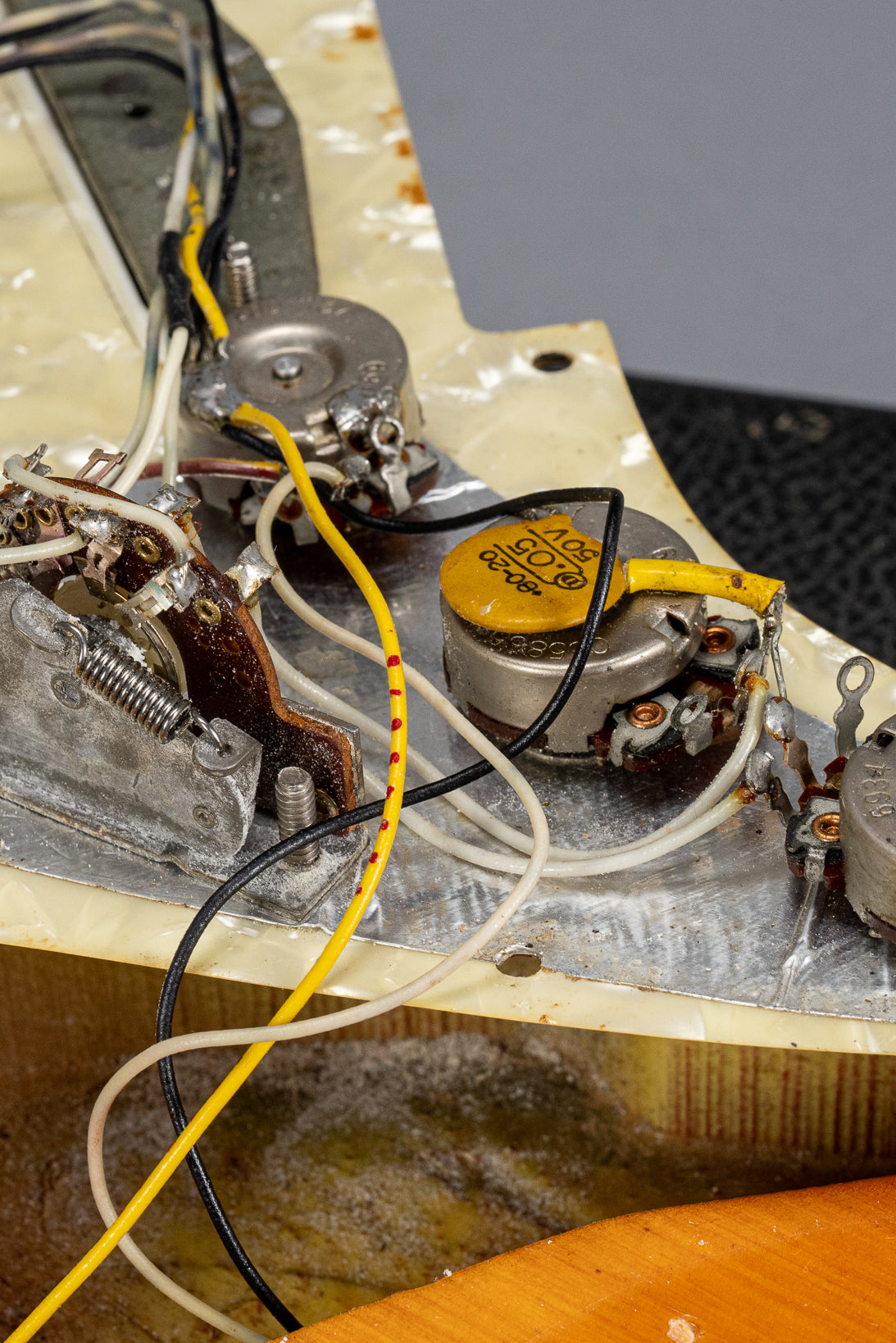 1970 Fender Stratocaster sunburst over white guitar interior pots, codes, wiring switch