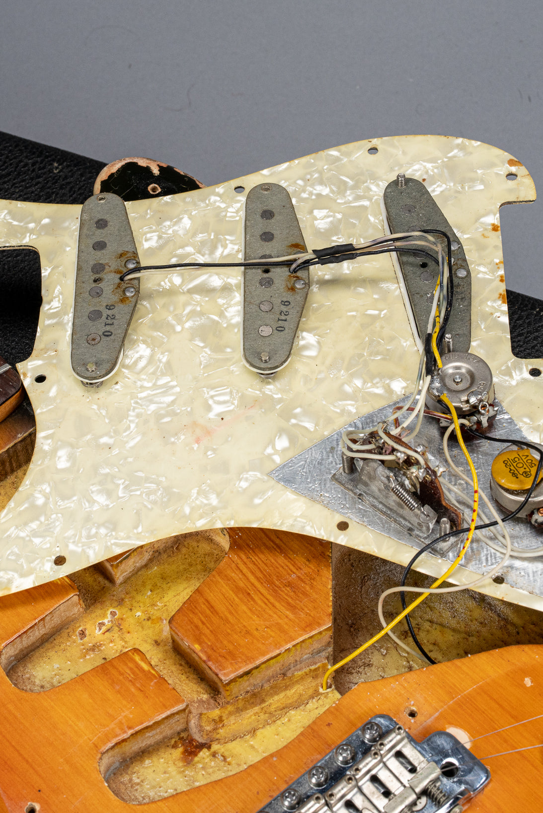 1970 Fender Stratocaster sunburst over white guitar interior cavities, wiring, electronics, pickups