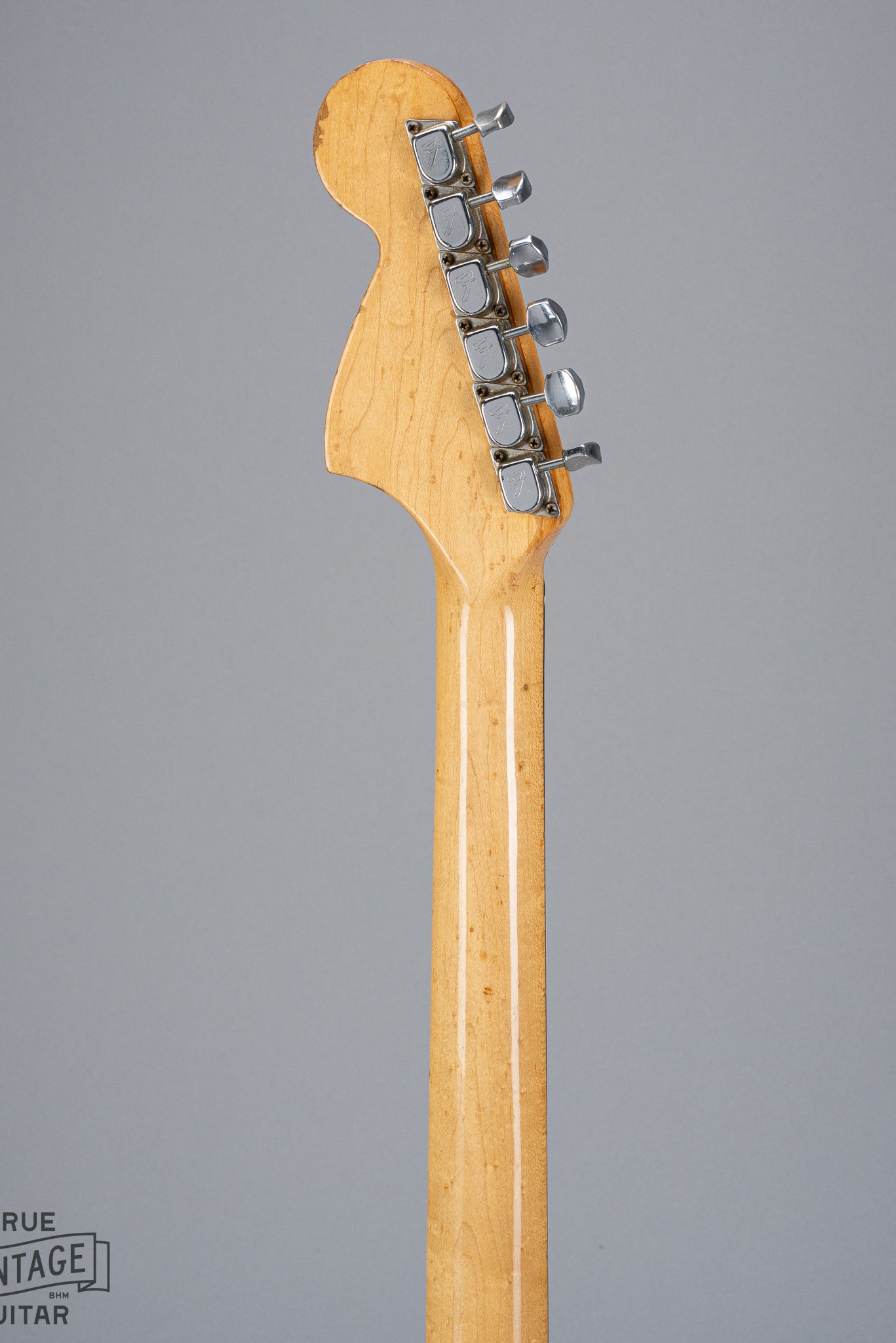 back of 1970 Fender Stratocaster sunburst over white headstock Fender guitar tuners