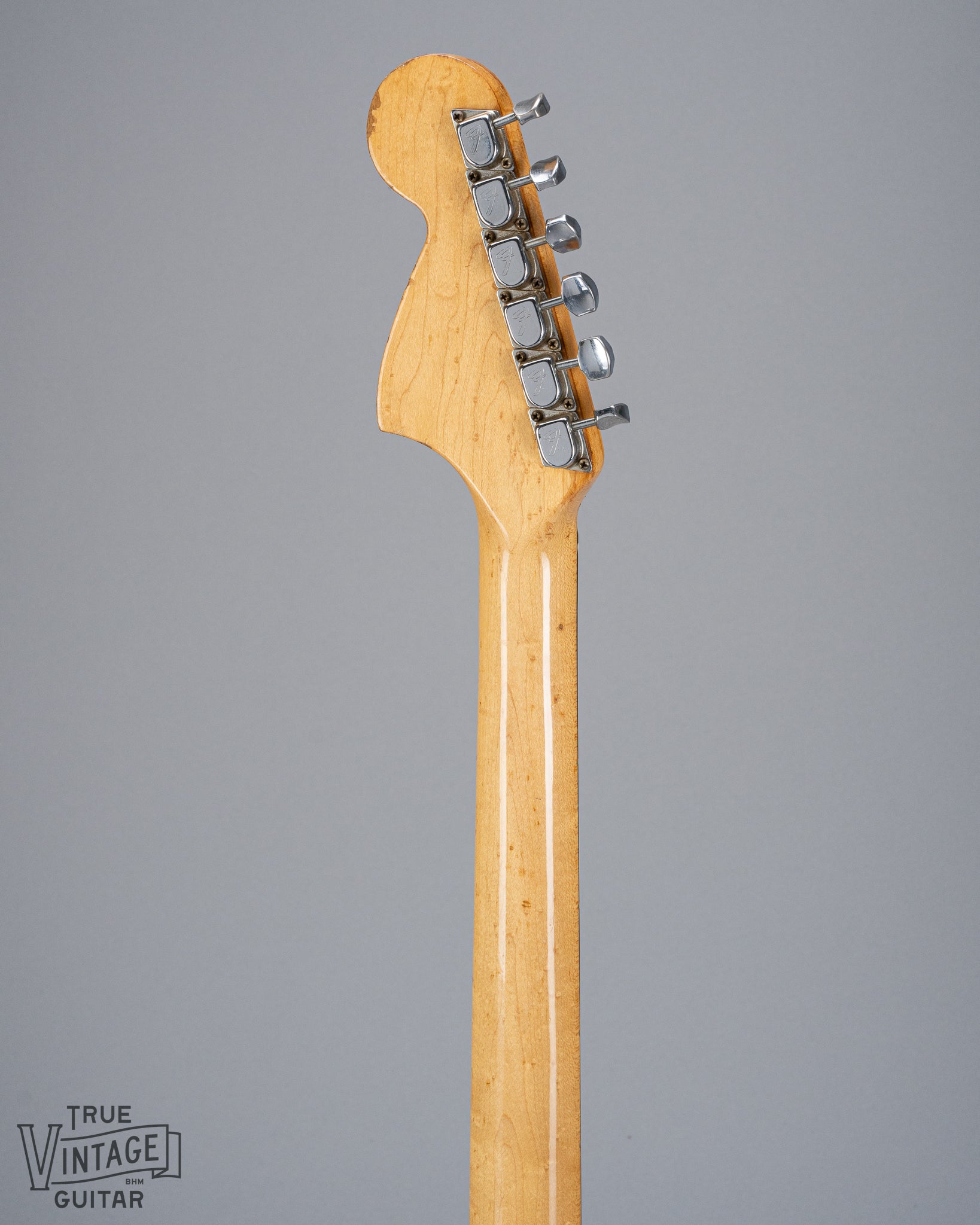 back of 1970 Fender Stratocaster sunburst over white headstock Fender guitar tuners