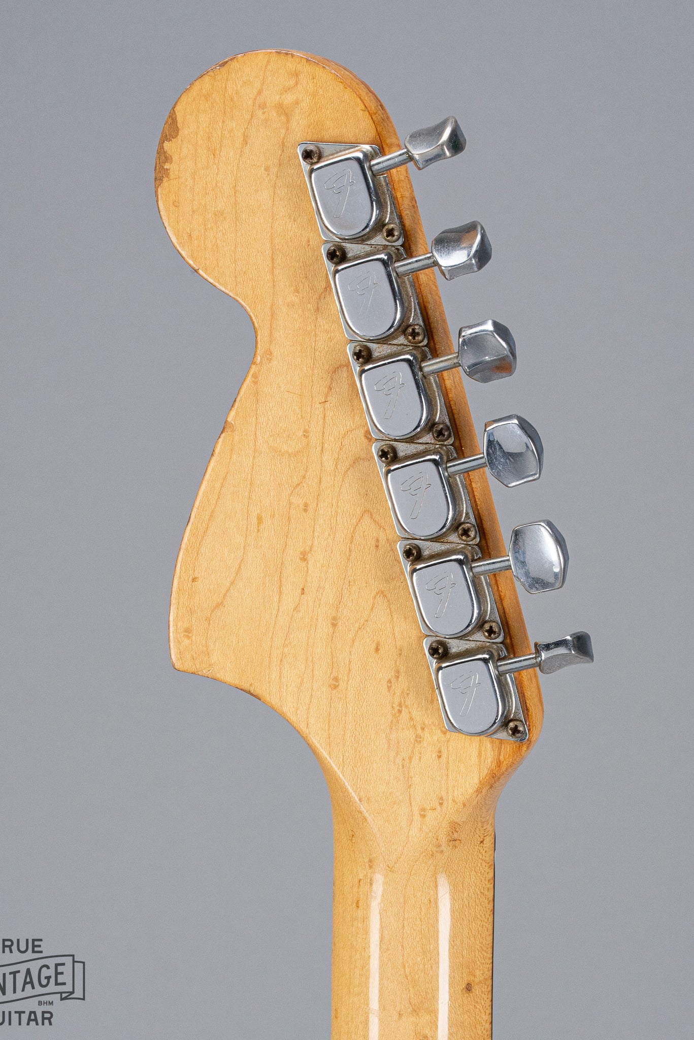 back of 1970 Fender Stratocaster sunburst over white headstock Fender logo tuners