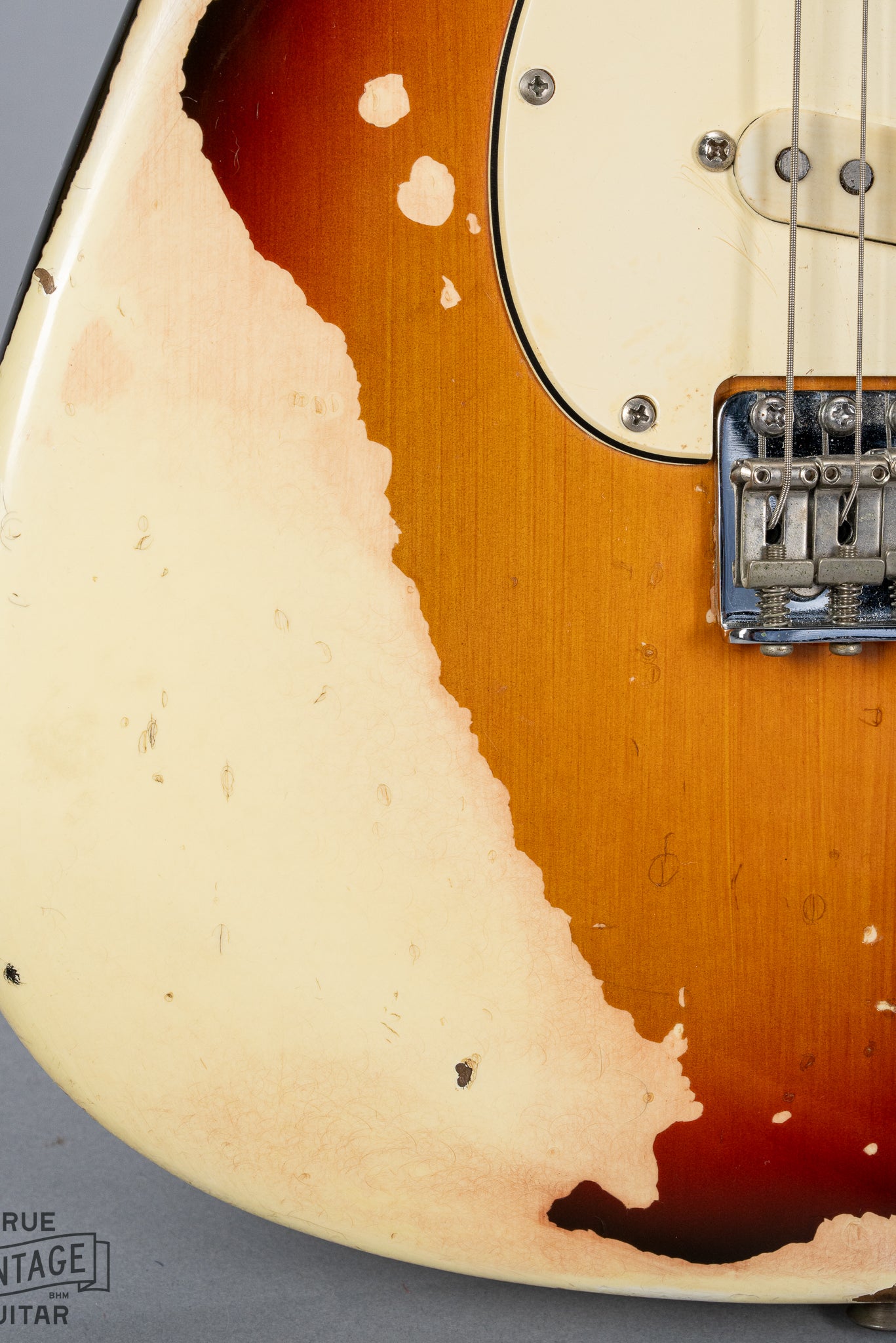 front of 1970 Fender Stratocaster sunburst over white finish distress