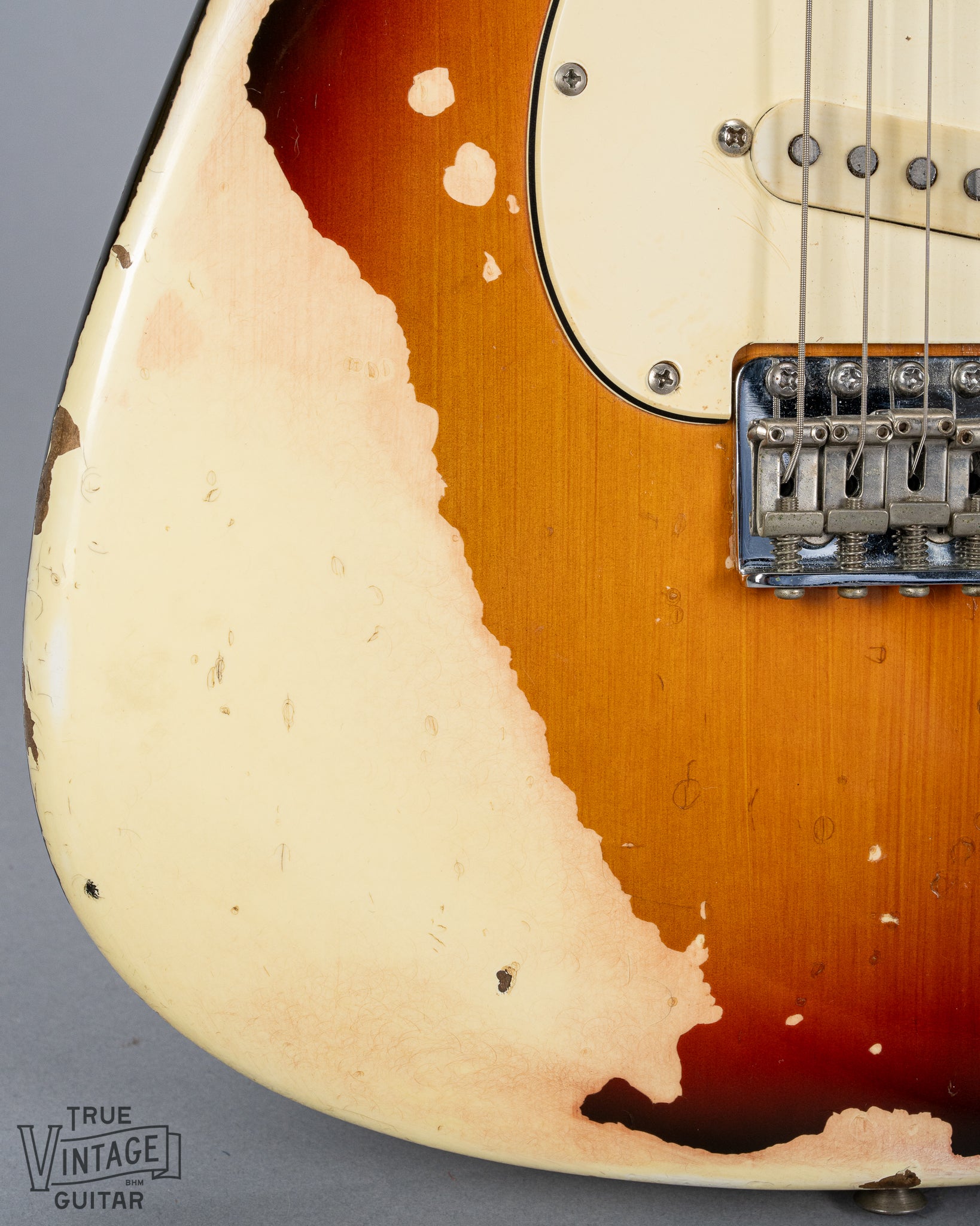 front of 1970 Fender Stratocaster sunburst over white finish distress