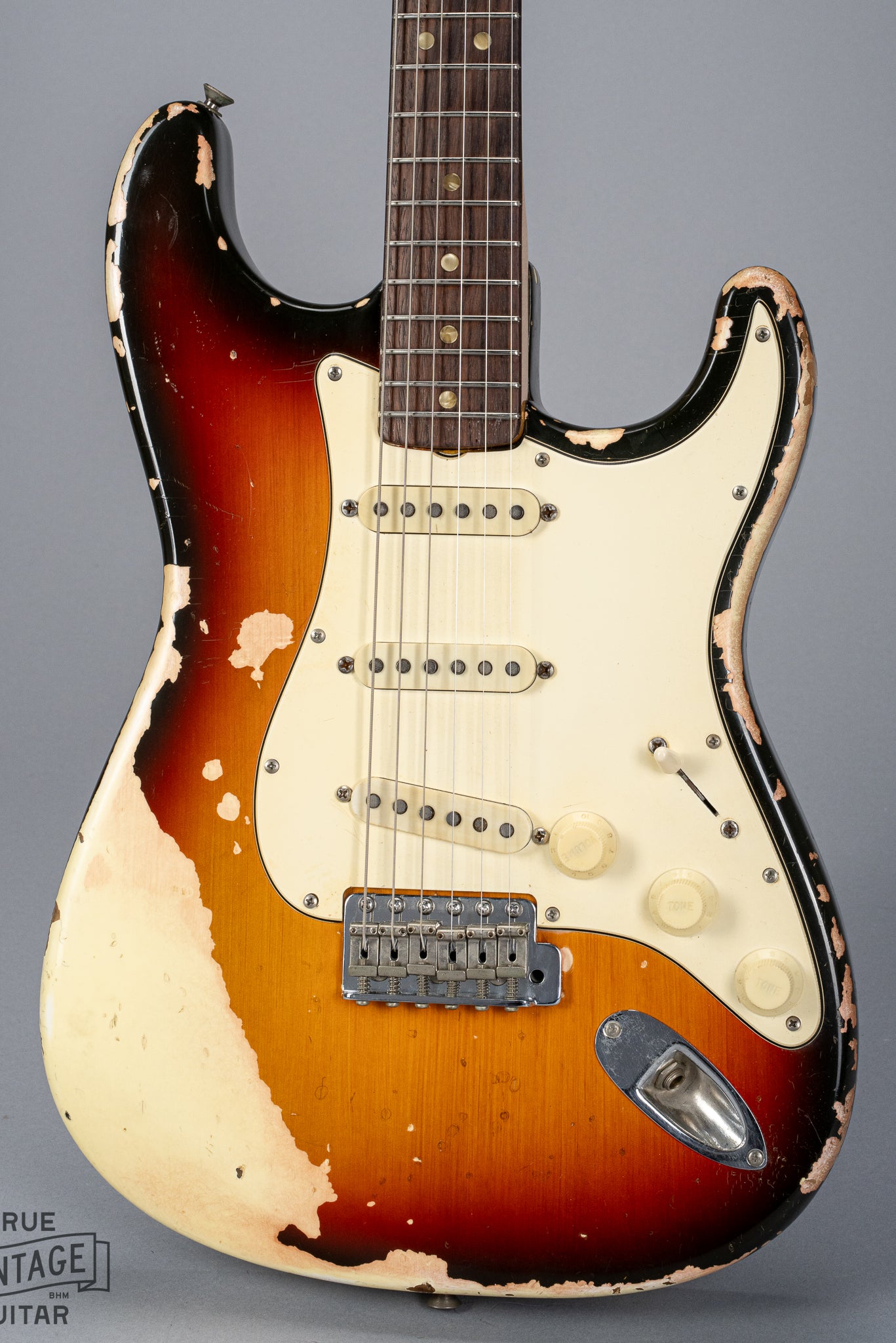 front of 1970 Fender Stratocaster sunburst over white finish distress original pickups bridge