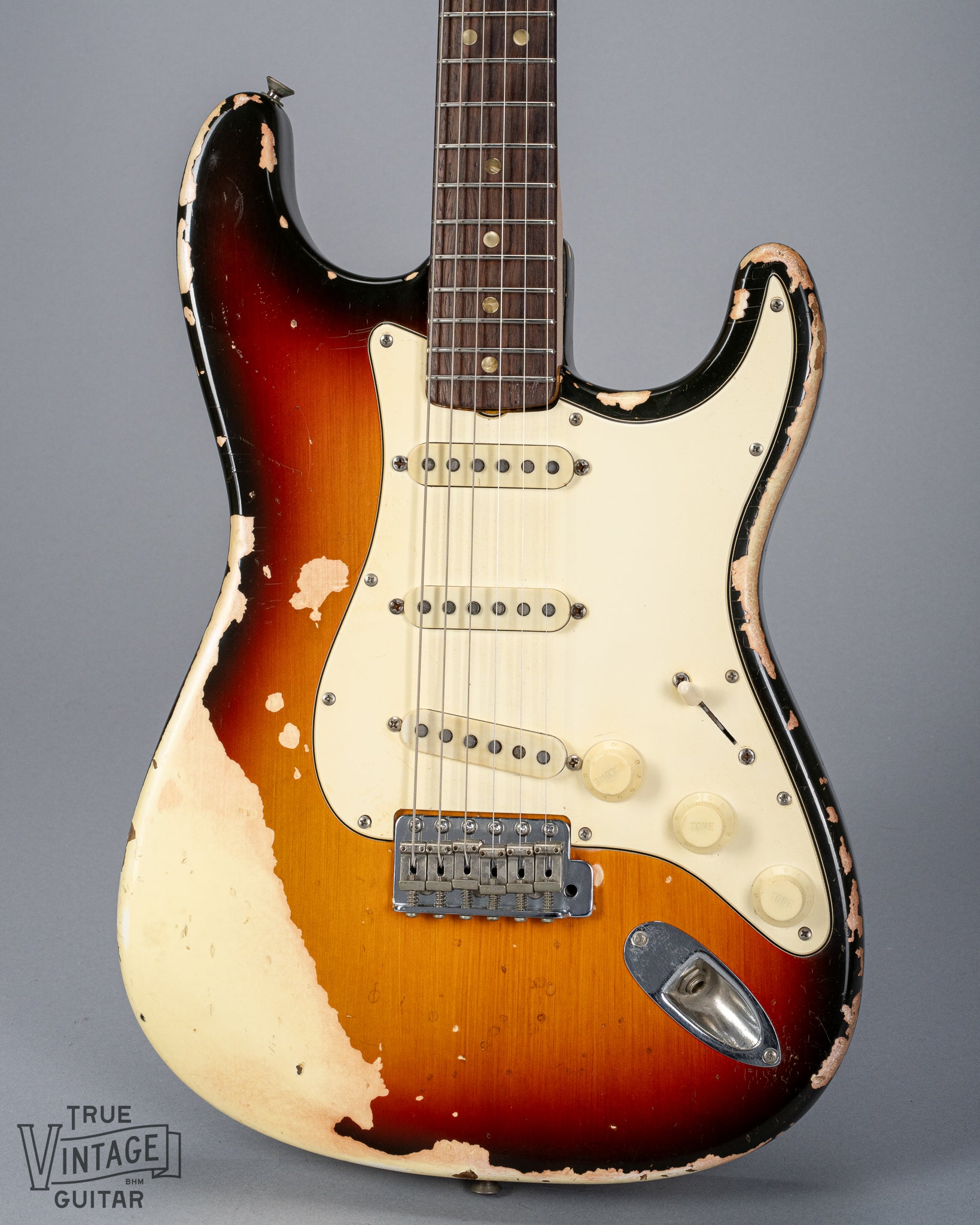 front of 1970 Fender Stratocaster sunburst over white finish distress original pickups bridge