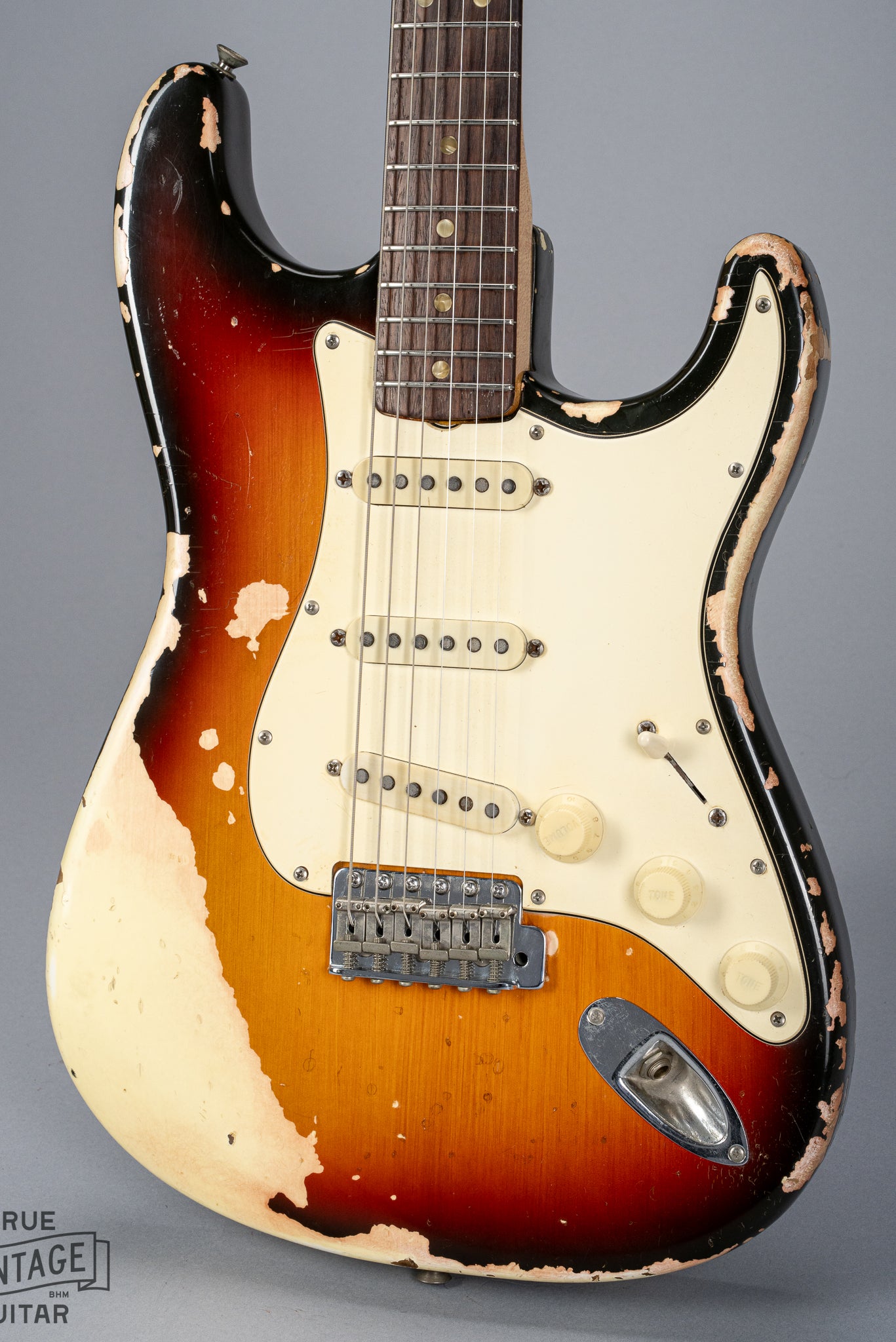 front of 1970 Fender Stratocaster sunburst over white finish distress original pickups bridge