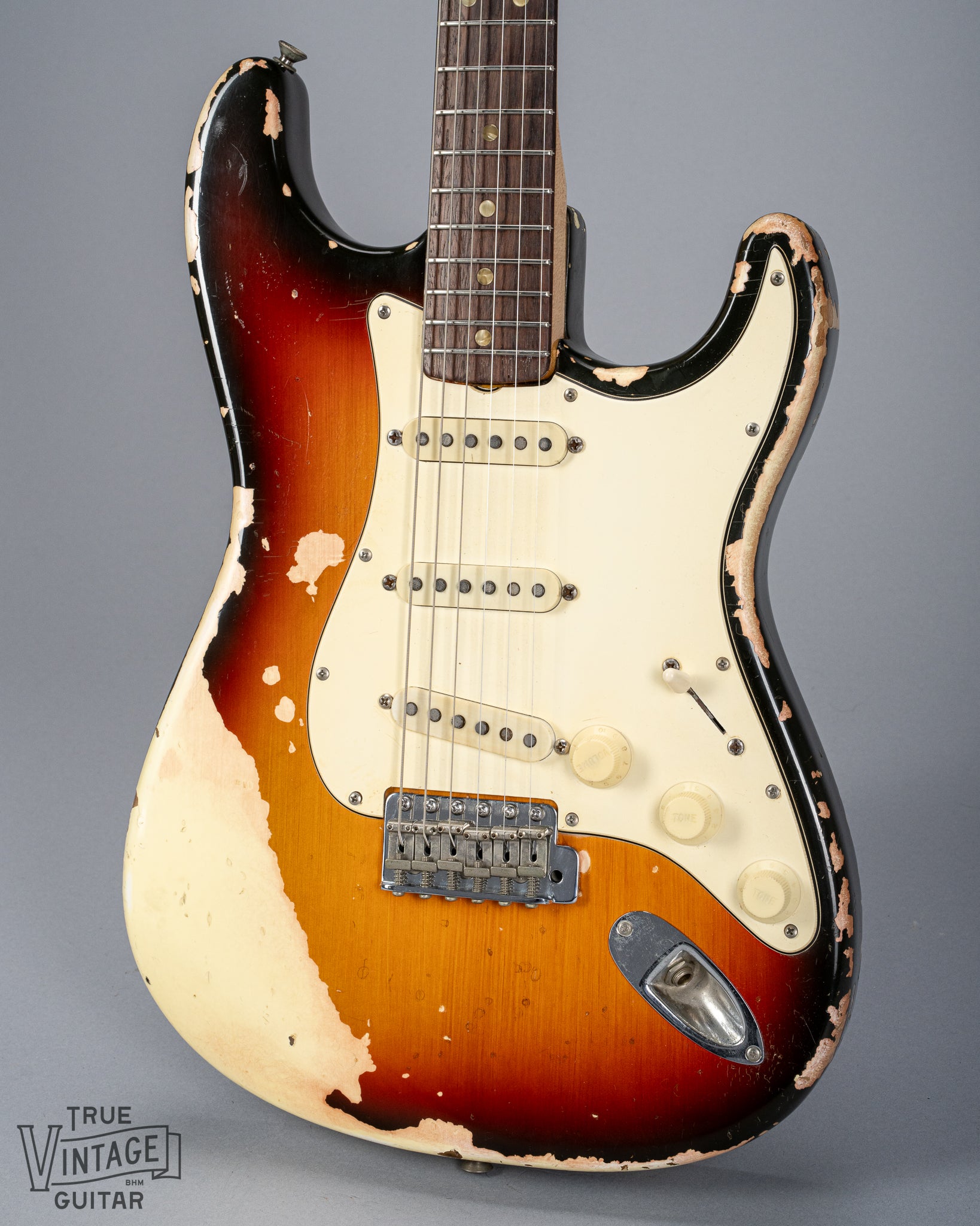 front of 1970 Fender Stratocaster sunburst over white finish distress original pickups bridge