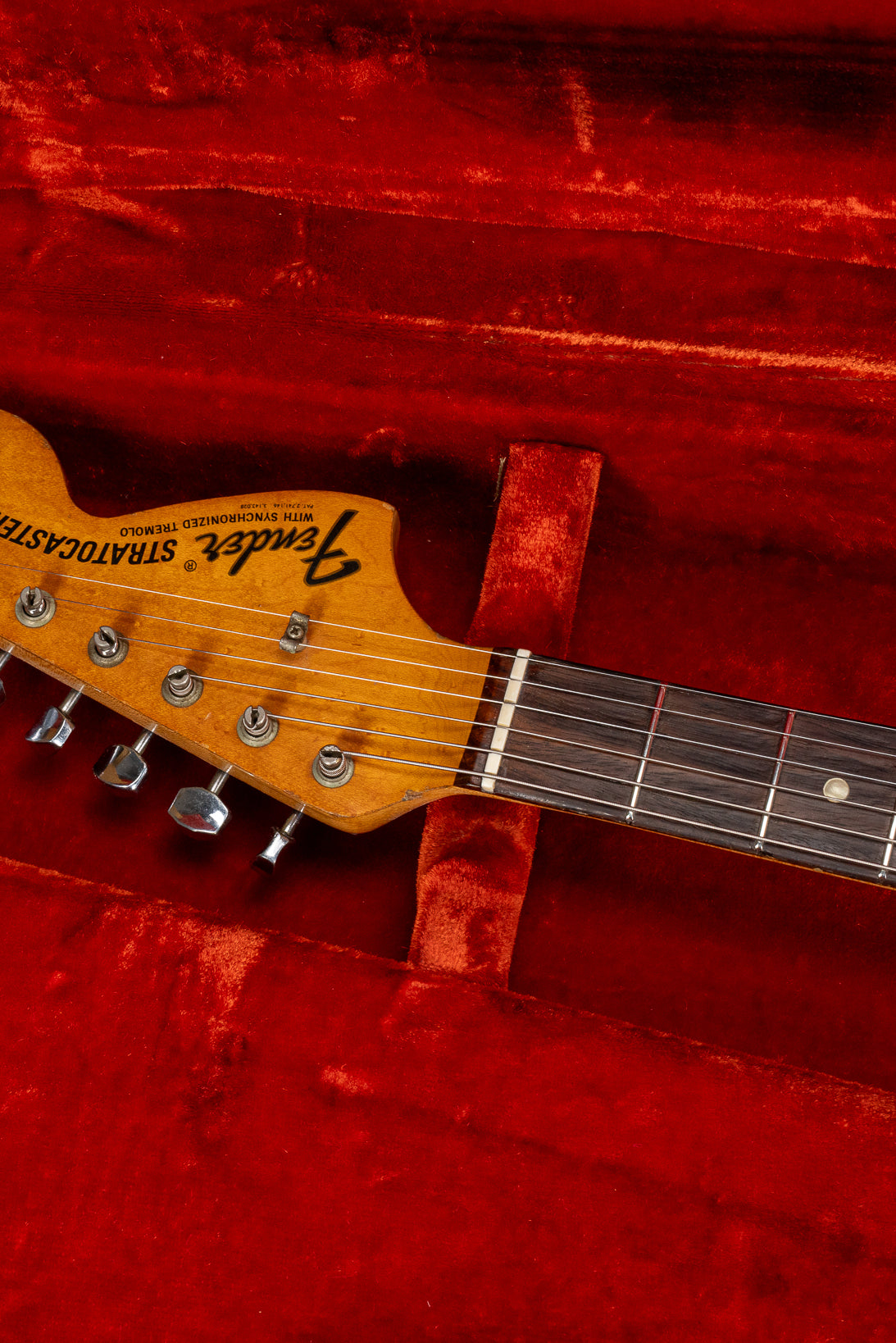 front of 1970 Fender Stratocaster sunburst over white headstock Fender logo tuners and original nut in original case