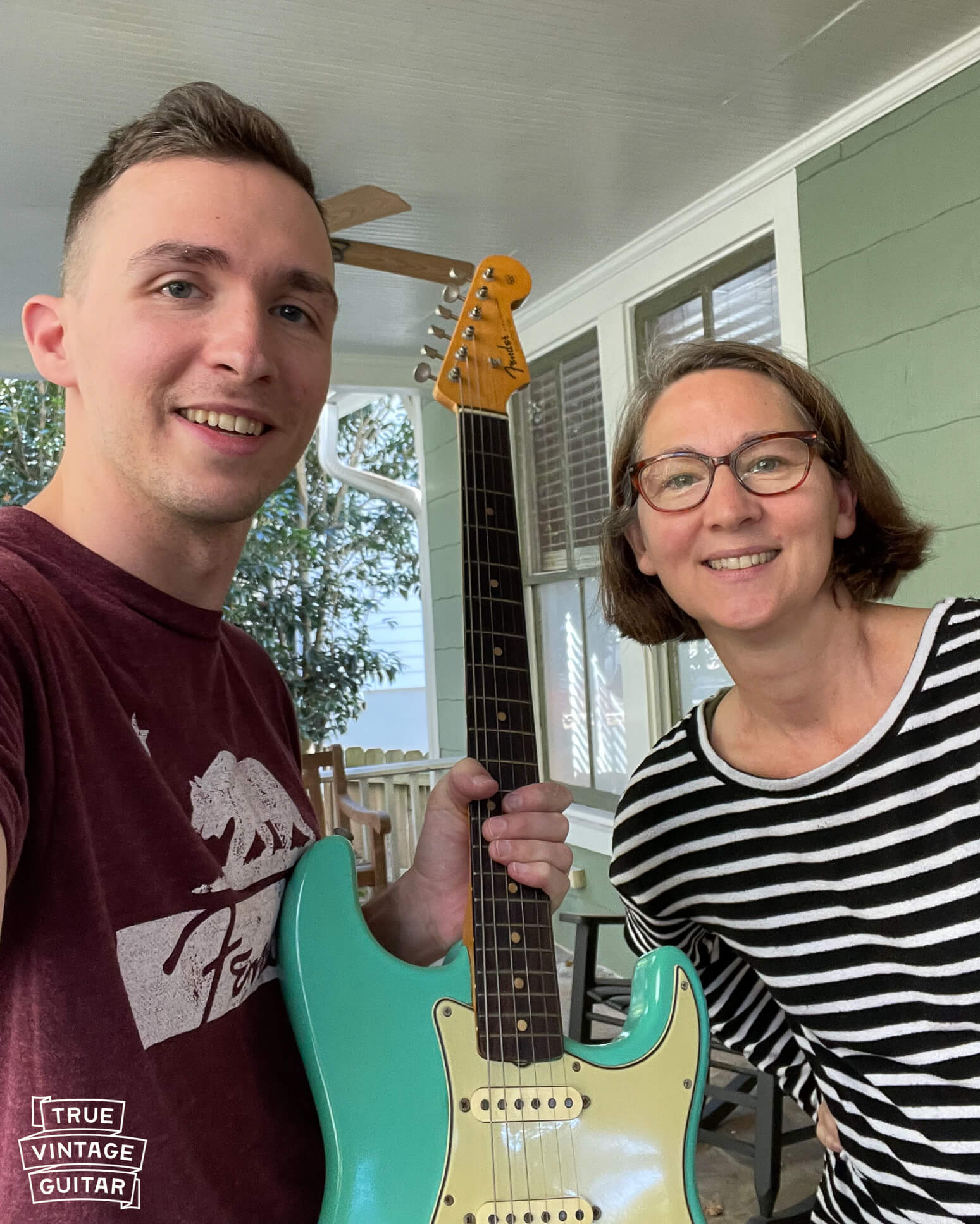 This image shows guitar collector John Shults helping someone sell their vintage 1960s Fender Stratocaster.