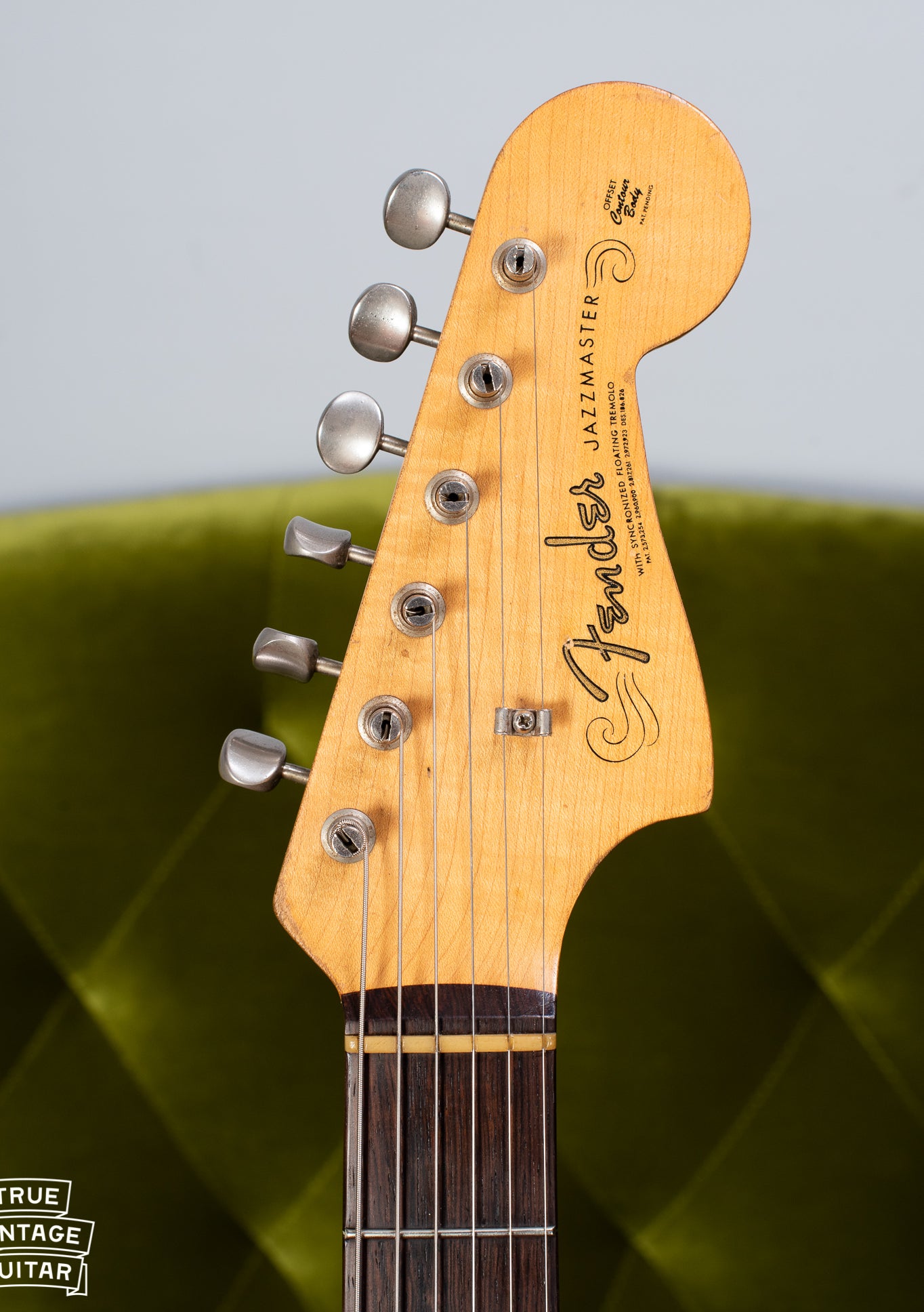 Jazzmaster headstock, slab fretboard, spaghetti logo
