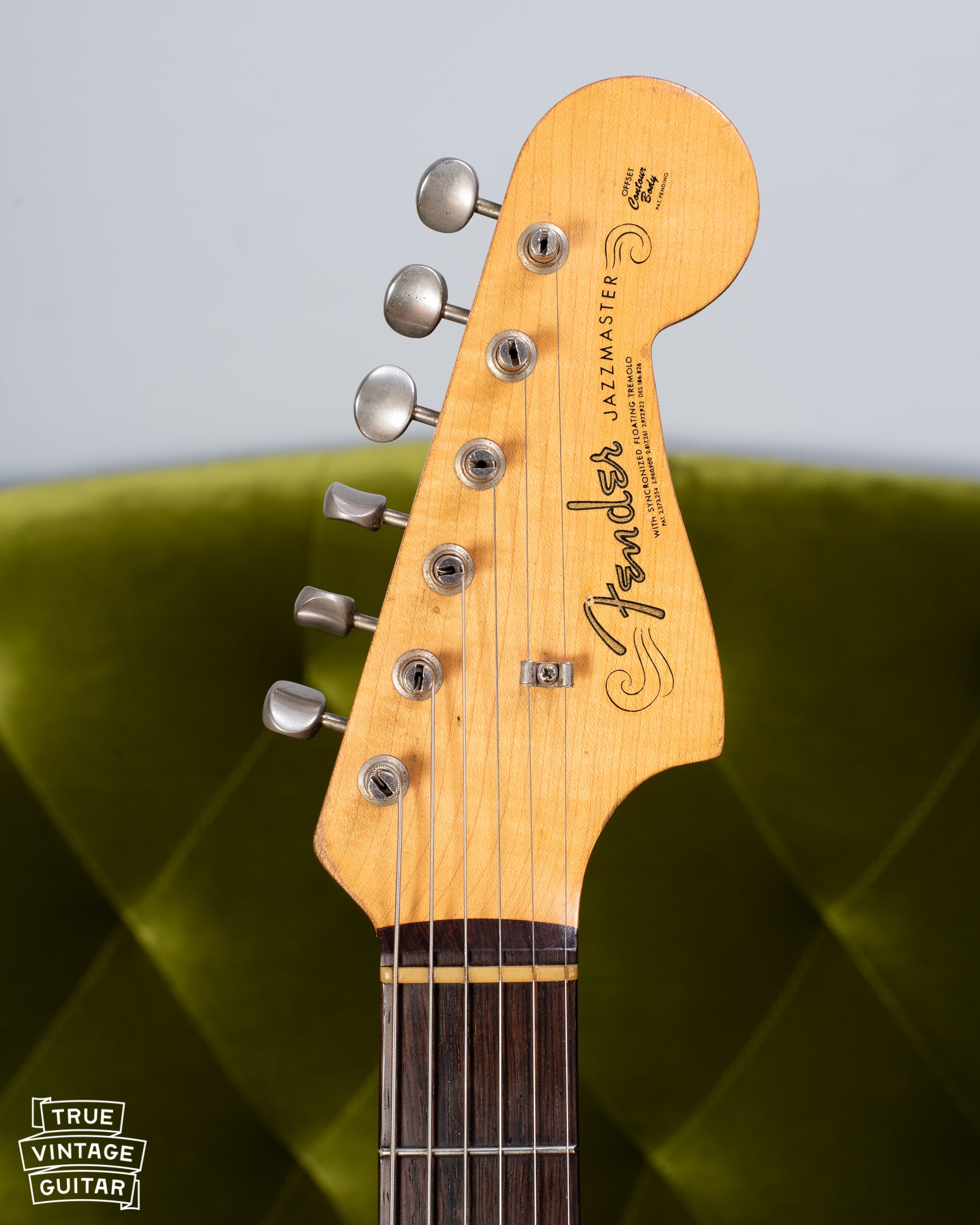Jazzmaster headstock, slab fretboard, spaghetti logo