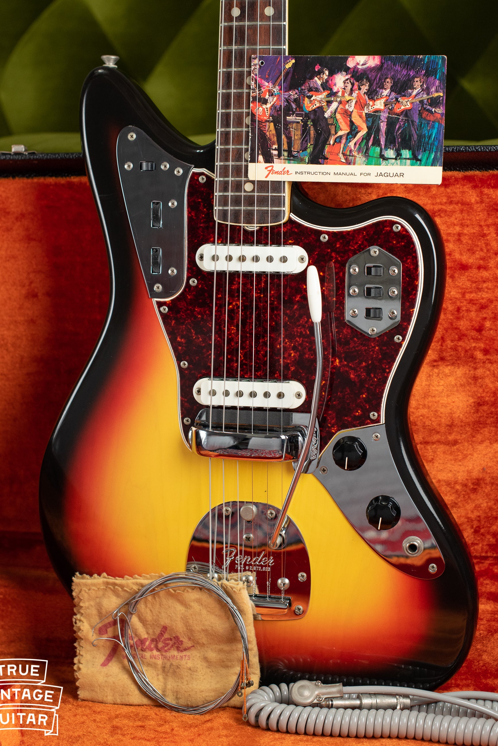 Vintage 1966 Fender Jaguar electric guitar, Sunburst finish, with hang tag and polish cloth