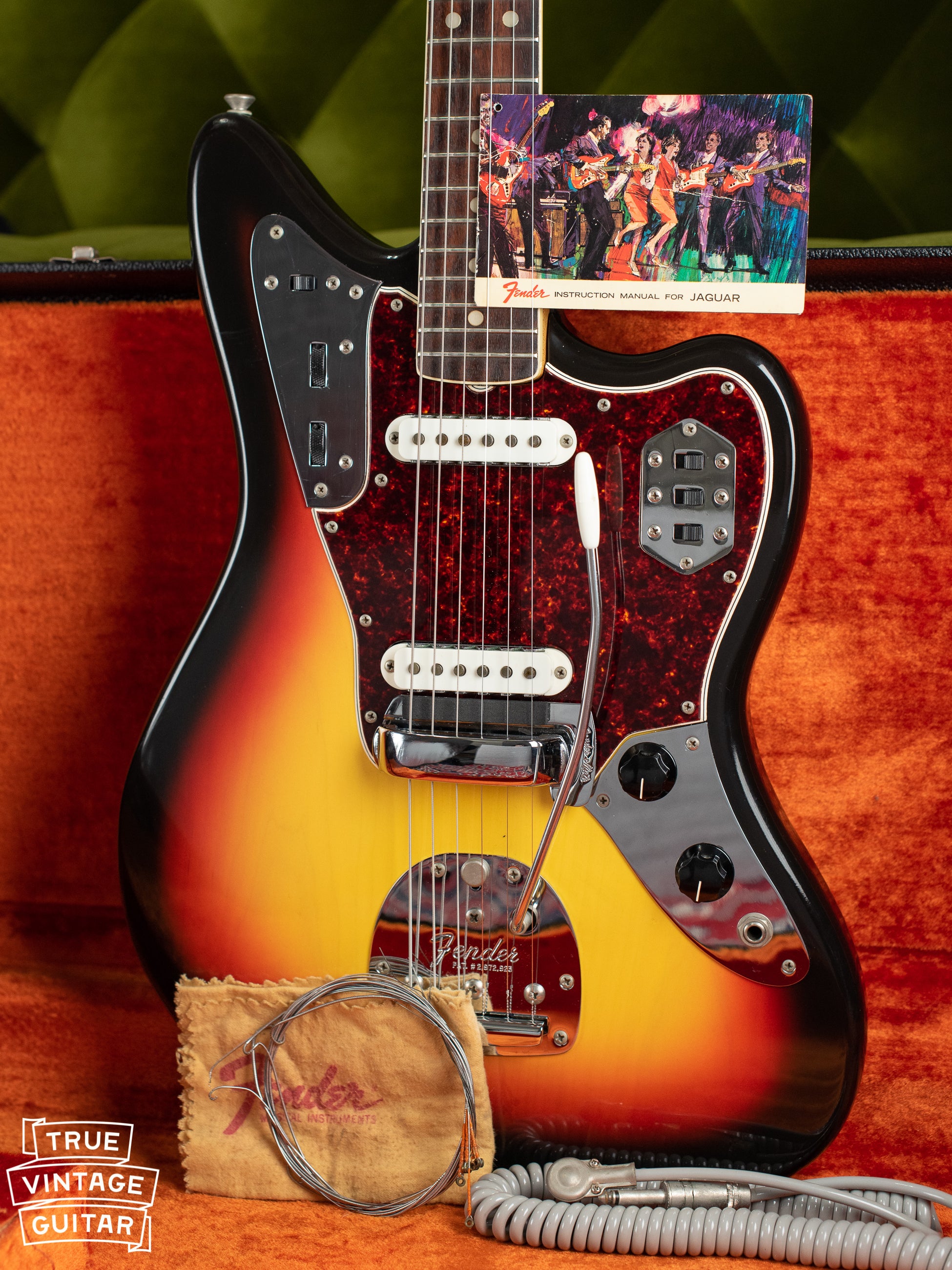 Vintage 1966 Fender Jaguar electric guitar, Sunburst finish, with hang tag and polish cloth