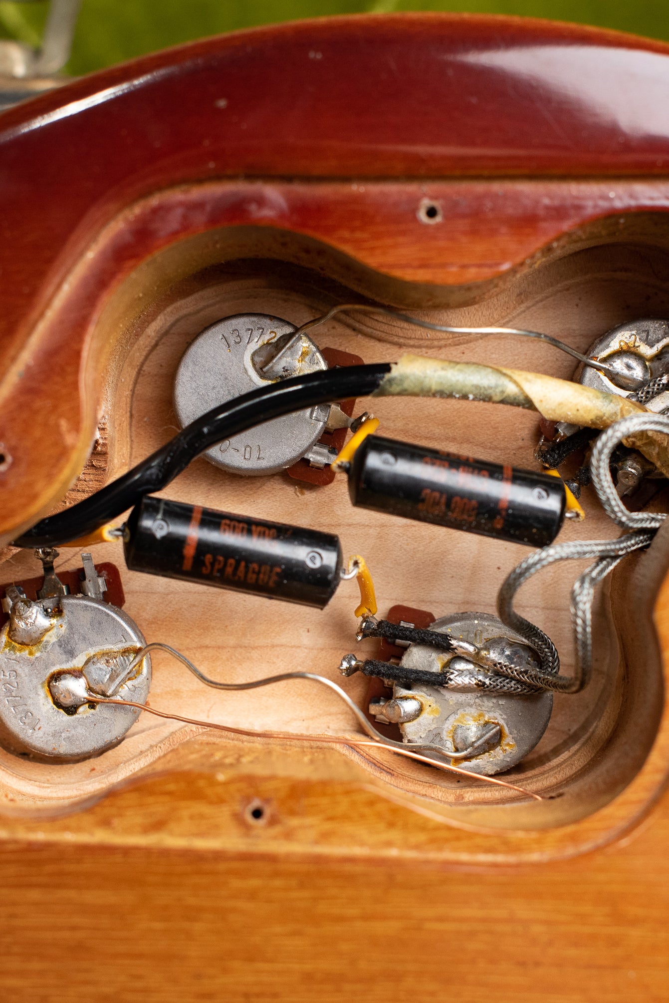 Control cavity, potentiometers, black Sprague capacitors, Vintage 1972 Gibson Les Paul Deluxe electric guitar