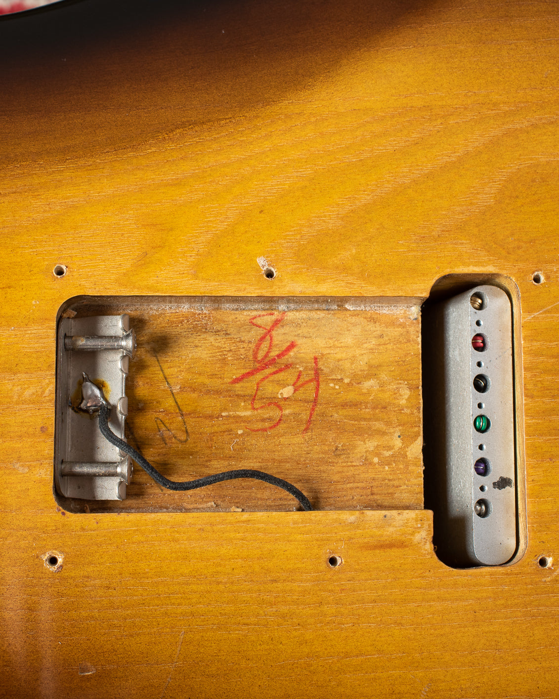 Fender Stratocaster 1954 tremolo cavity with "8/54/" red pencil signature