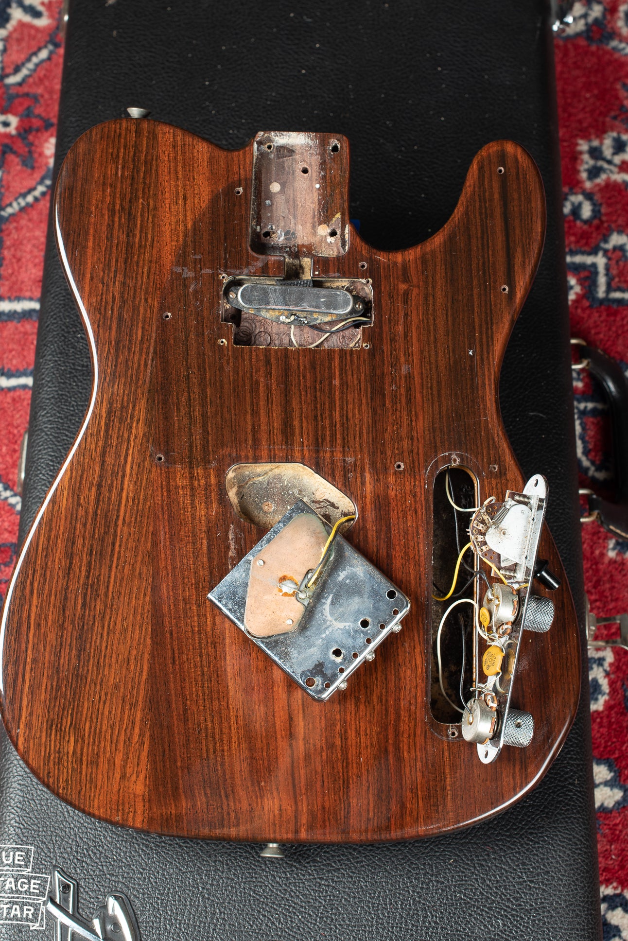Fender Rosewood Telecaster 1971 with pickguard and bridge plate removed. The Neck pickup cavity is routed for a humbucking pickup.