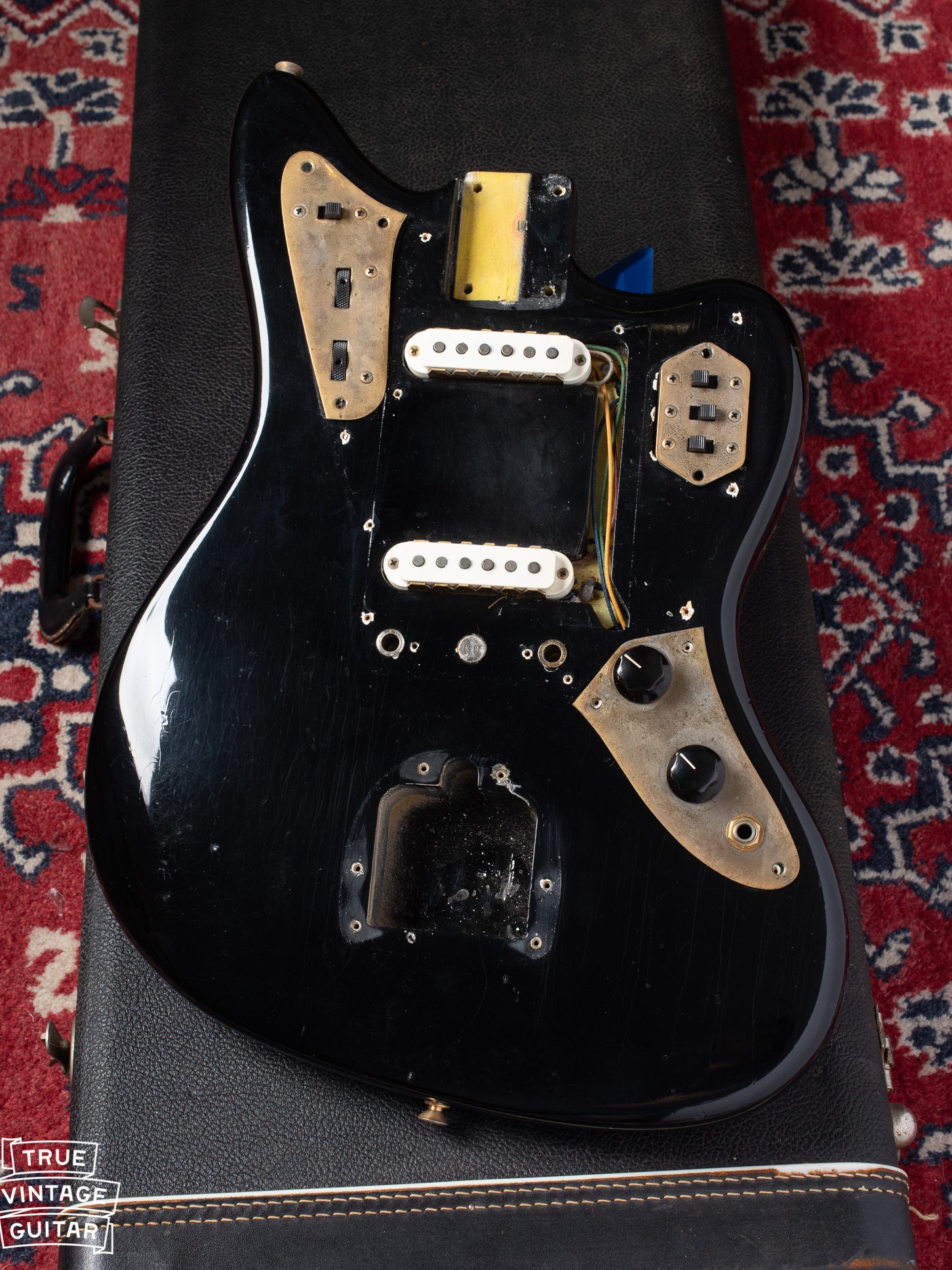 Under pickguard shot with white undercoat