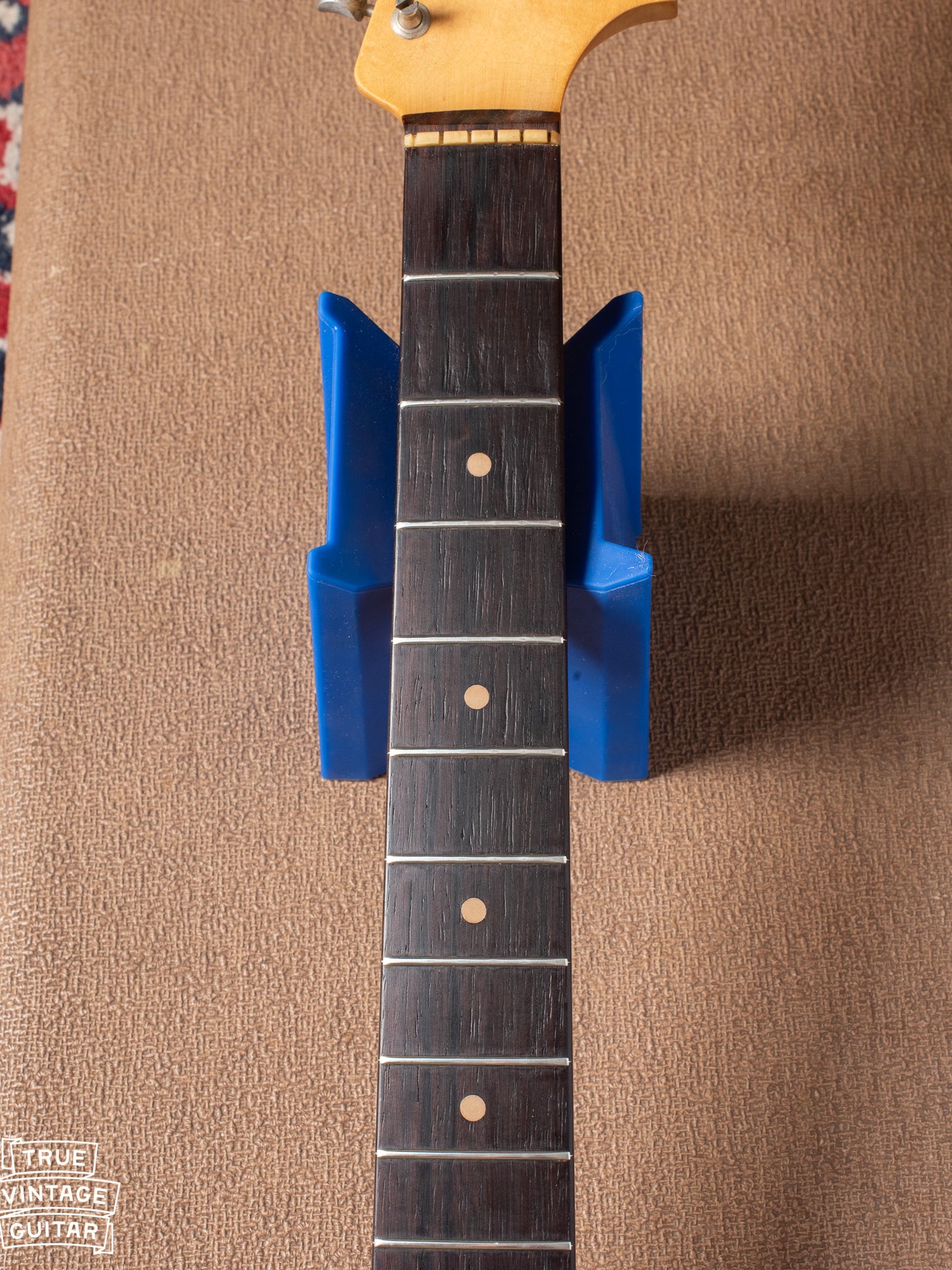 Original frets on Rosewood neck with clay dot markers
