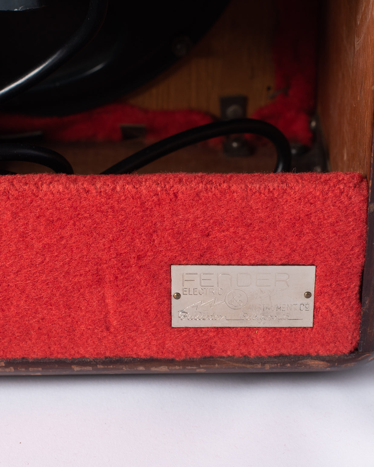 Fender metal badge on 1946 Model 26 Woody Amp