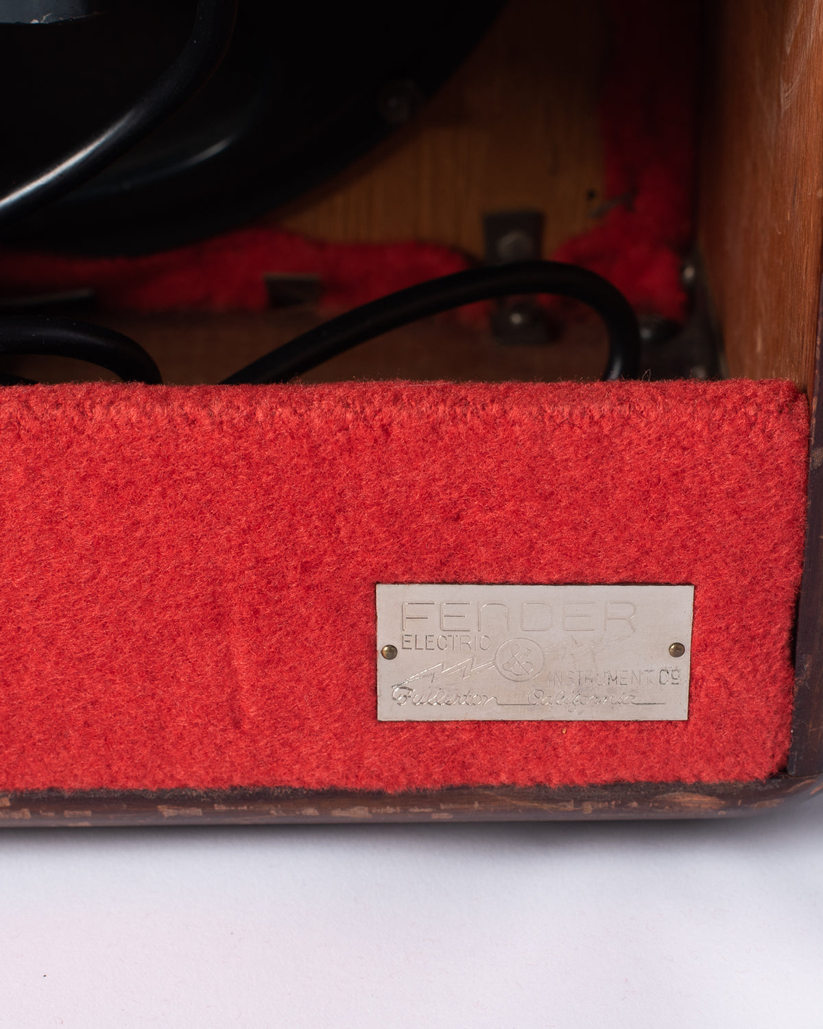 Fender metal badge on 1946 Model 26 Woody Amp