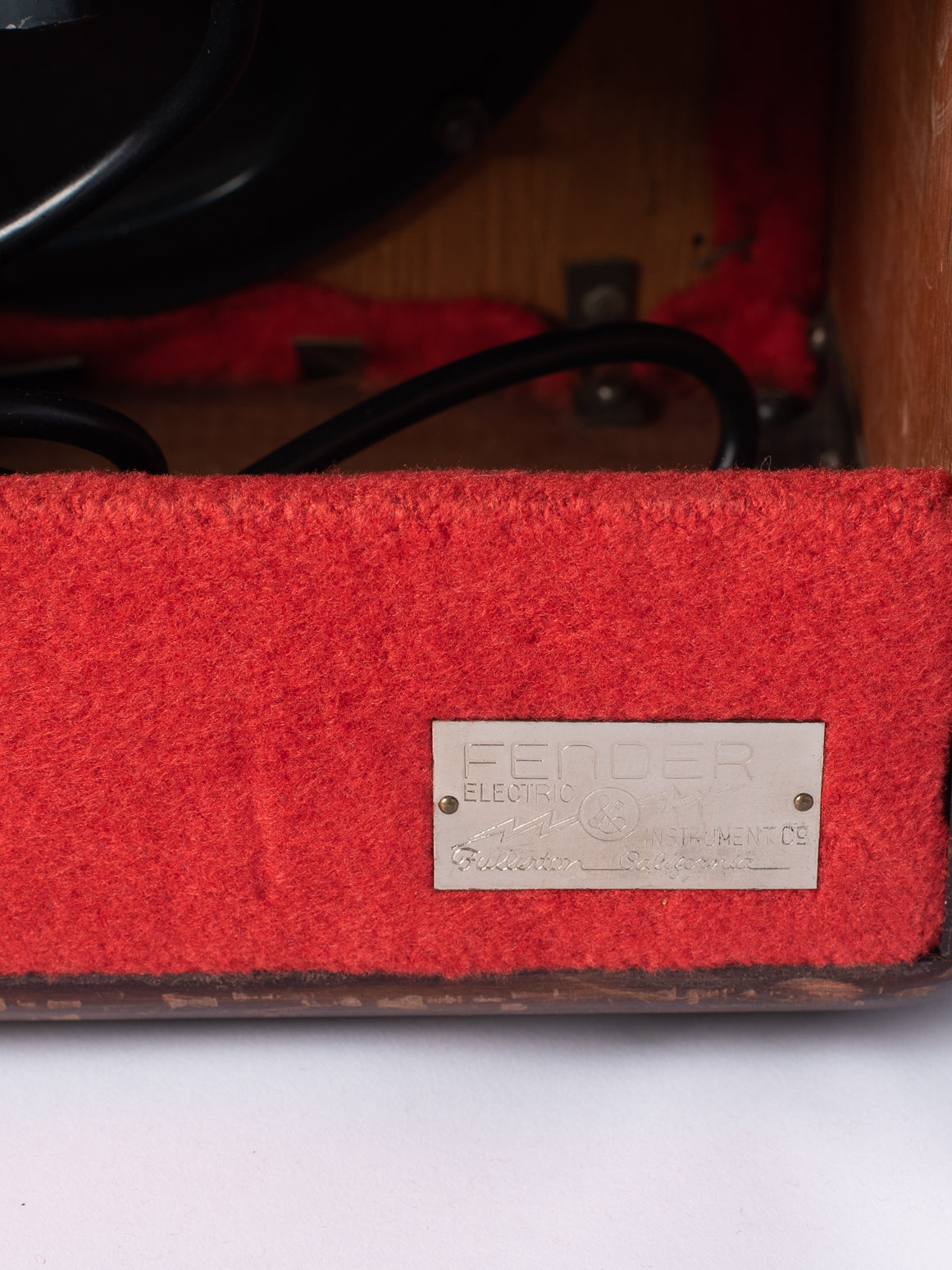 Fender metal badge on 1946 Model 26 Woody Amp
