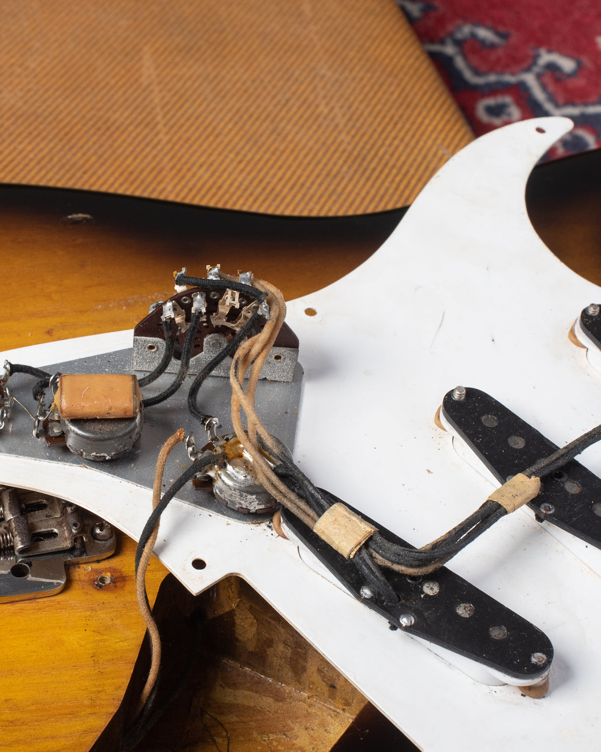 Three way switch, potentiometers, capacitor, black bobbin pickups