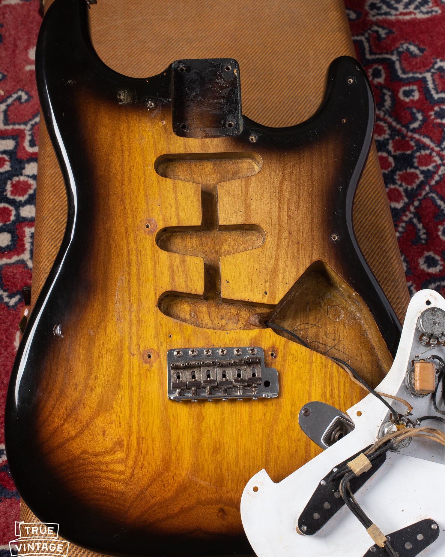 Ash body under pickguard of Fender Stratocaster 1954