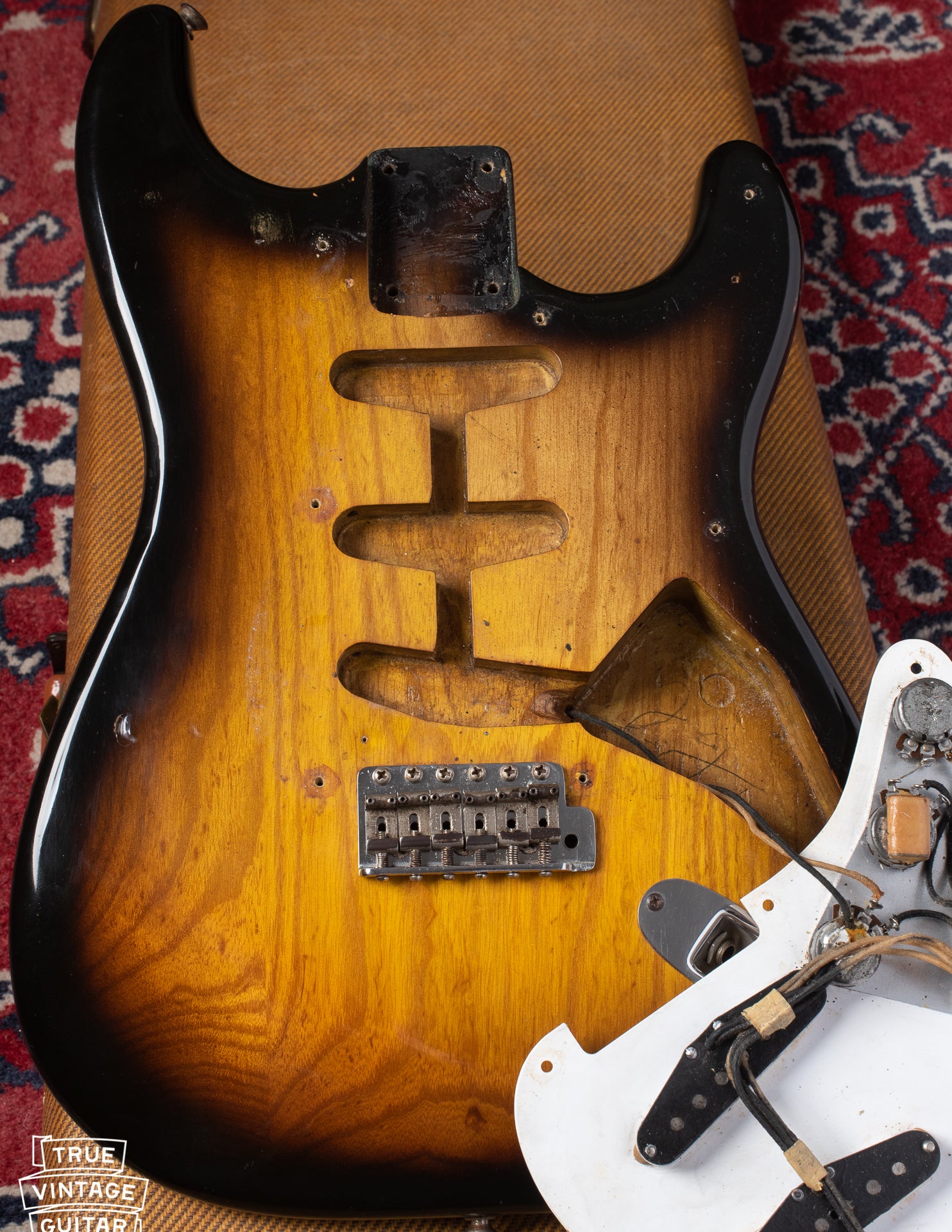 Ash body under pickguard of Fender Stratocaster 1954