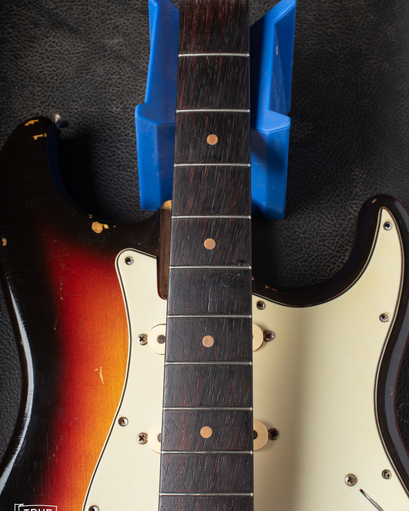 Rosewood fretboard with clay dots. Factory style refret.