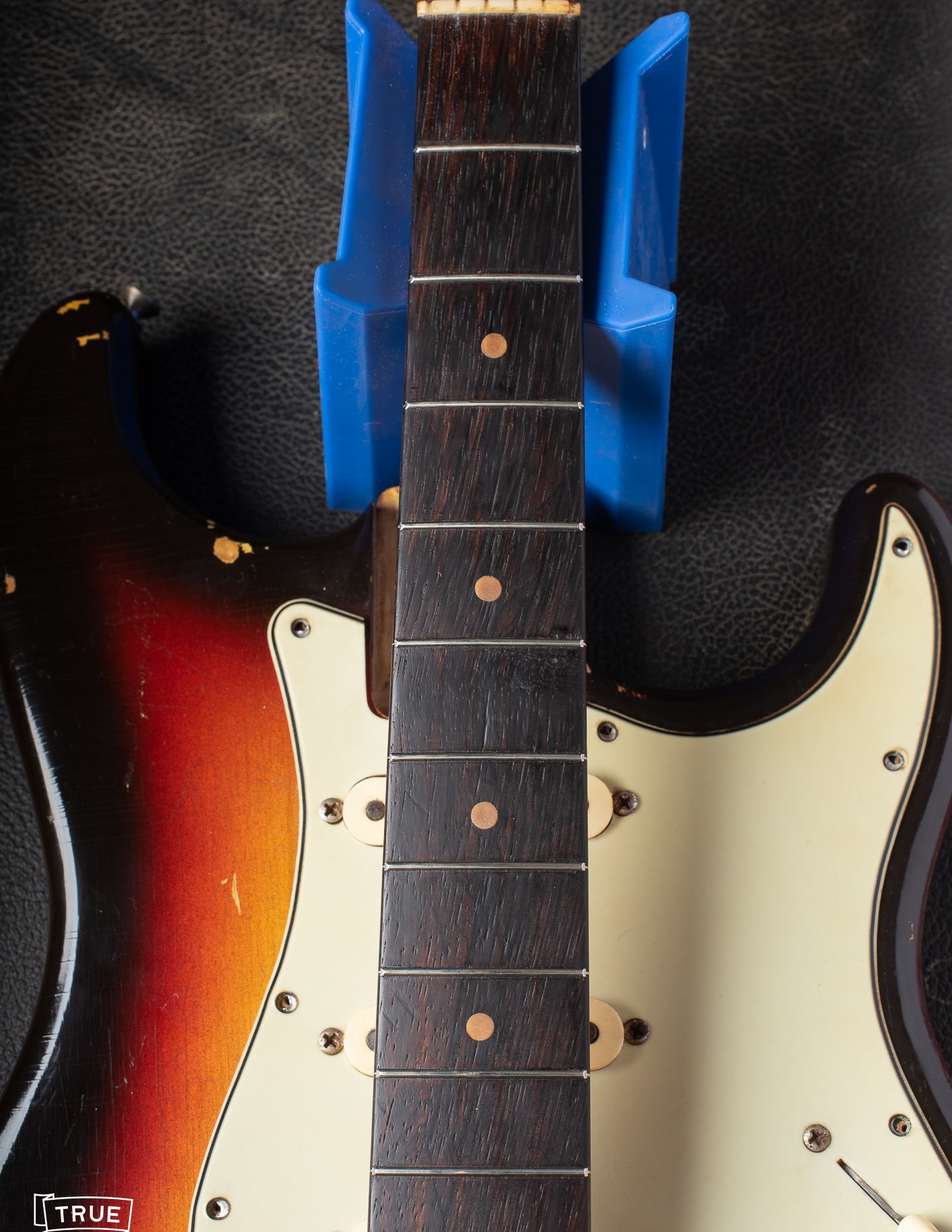 Rosewood fretboard with clay dots. Factory style refret.