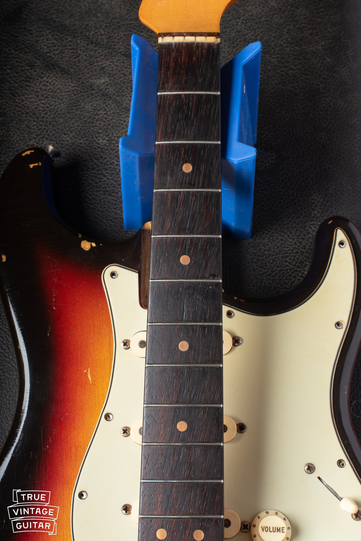 Rosewood fretboard with clay dots. Factory style refret.