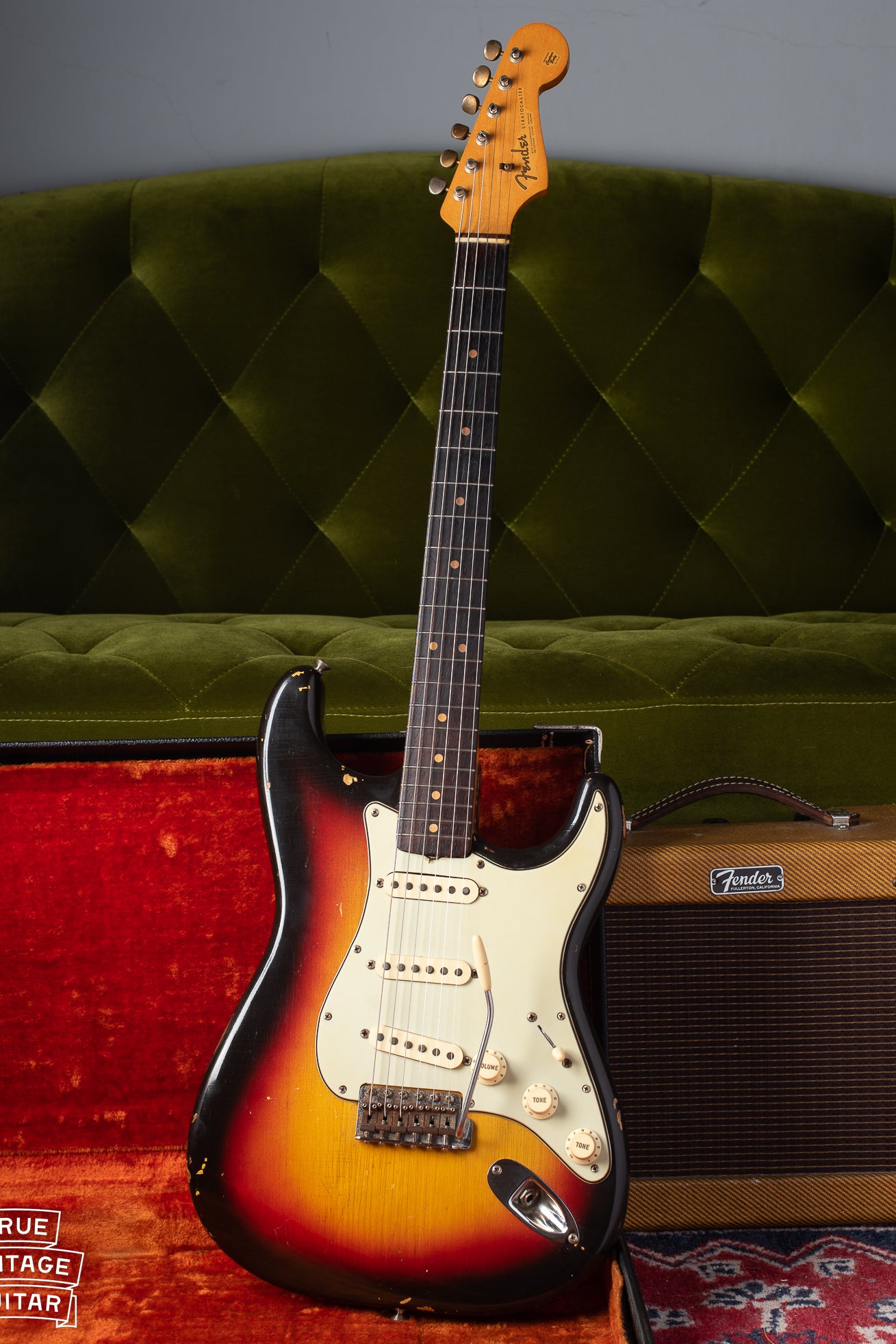 1963 Fender Stratocaster with Sunburst finish, mint green pickguard