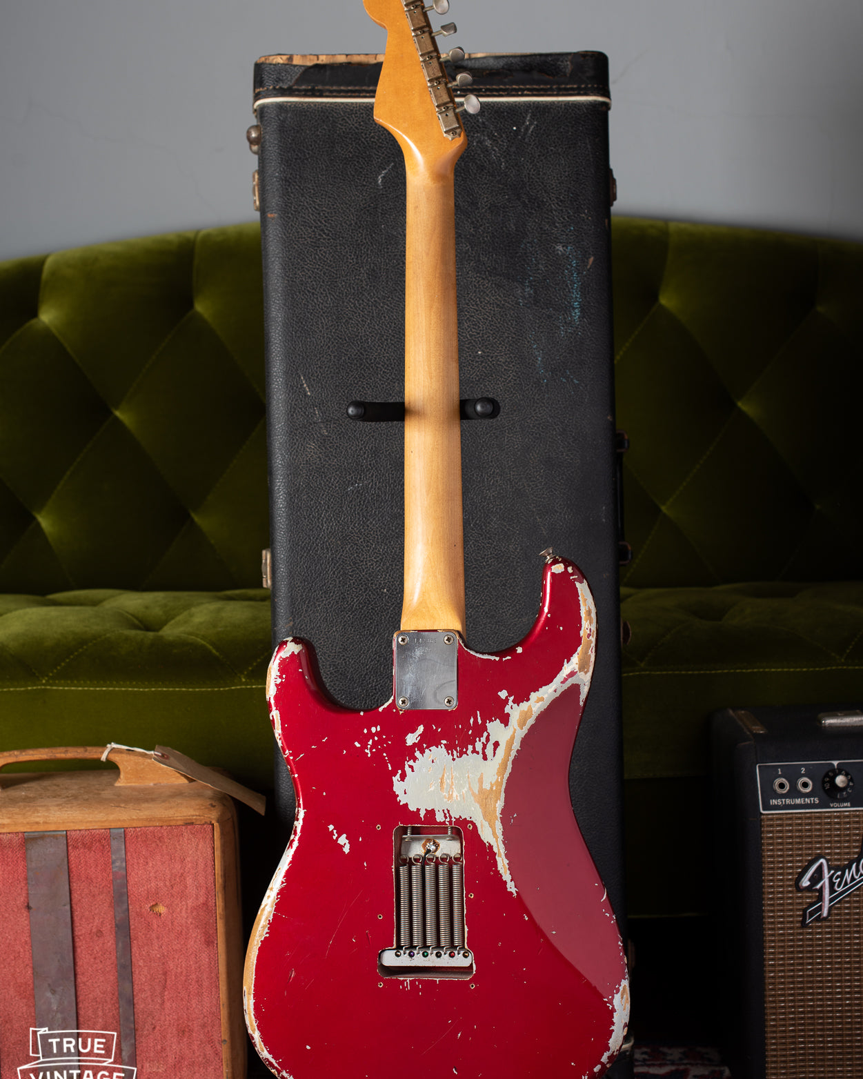 Back of Fender Stratocaster 1964 with worn Candy Apple Red finish
