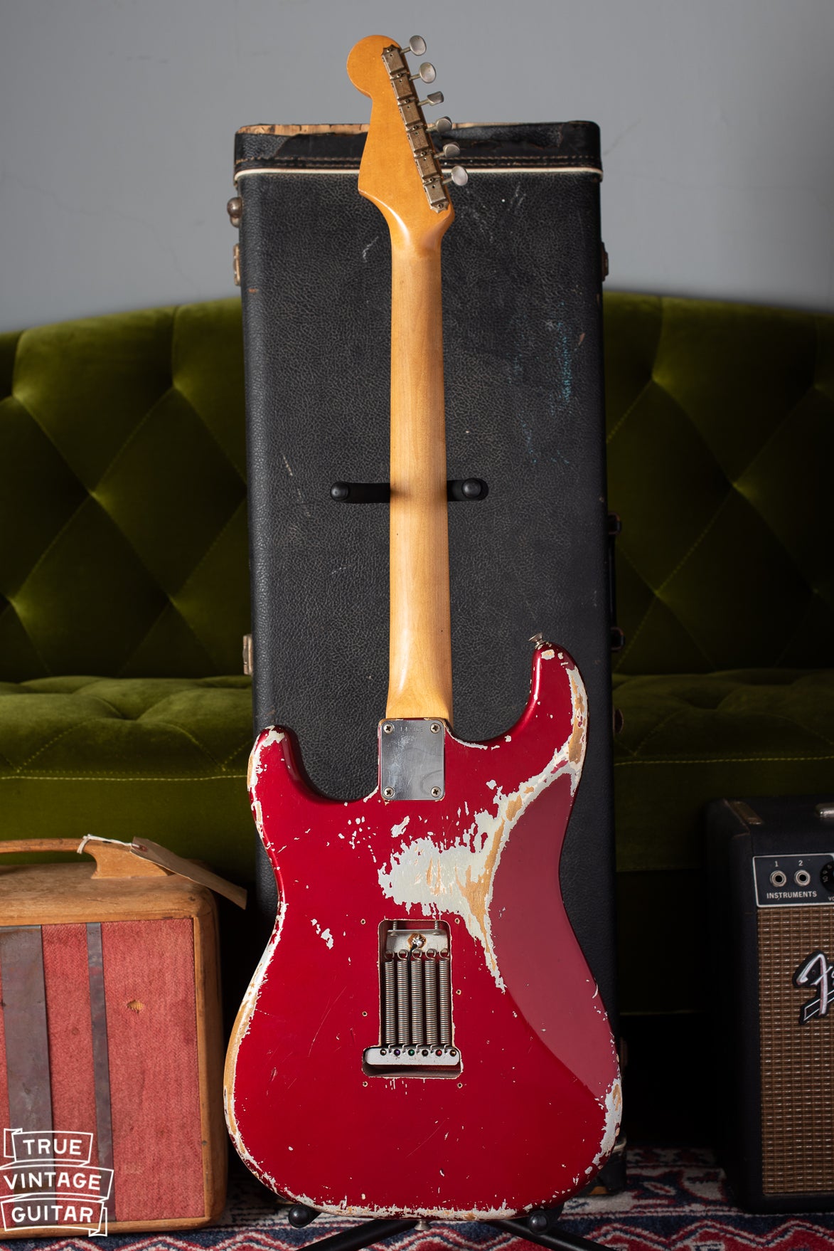 Back of Fender Stratocaster 1964 with worn Candy Apple Red finish