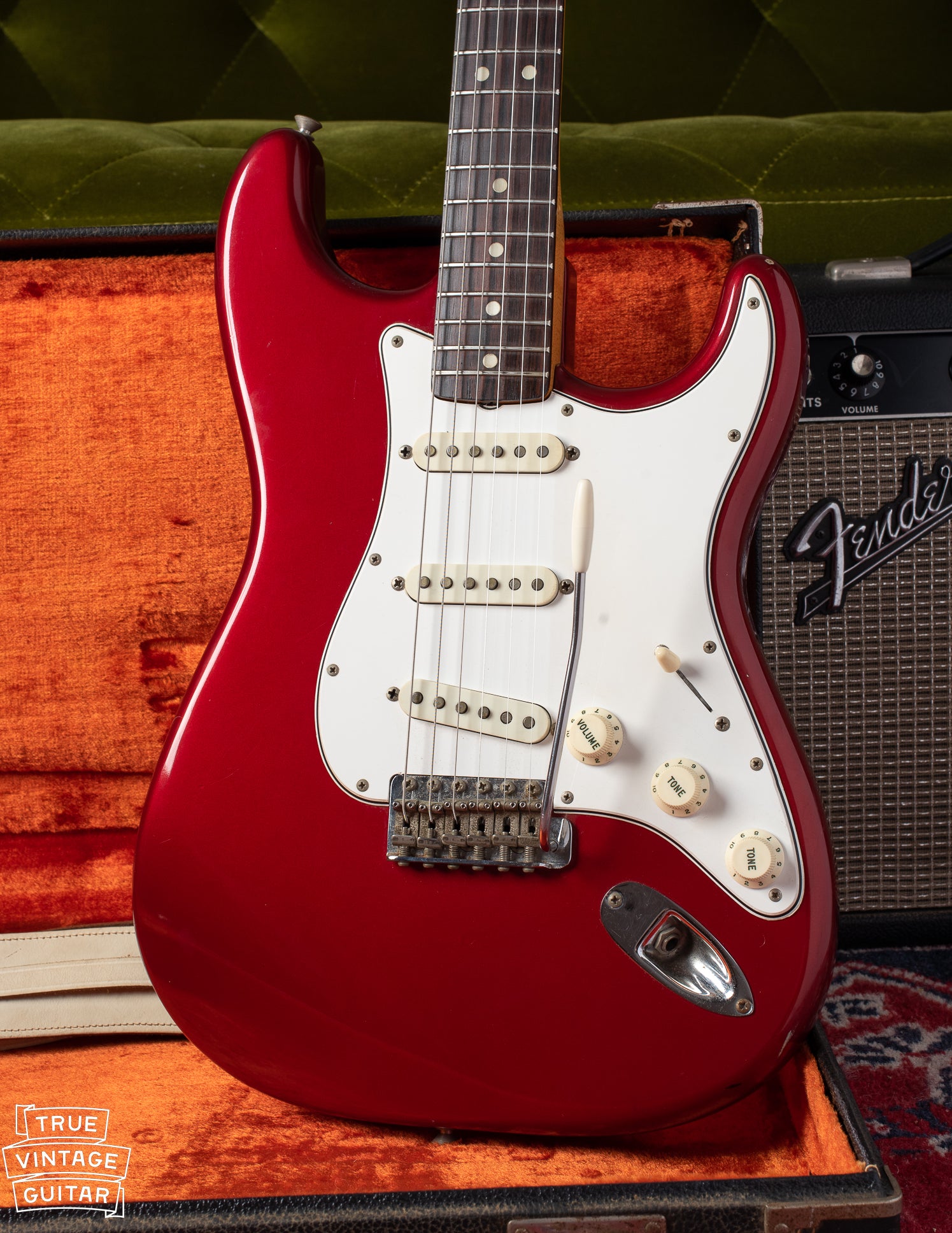 1965 Fender Stratocaster with candy apple red finish and white pickguard